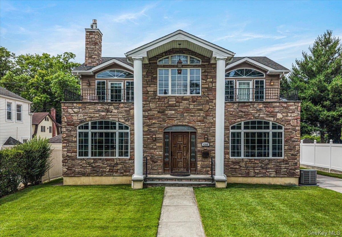 Welcome to 4308 Glenwood Street, where timeless elegance meets modern luxury. From the moment you arrive, you’ll be captivated by the home’s striking stone veneer exterior, impressive prominent front columns, oversized windows, and two stunning balconies that create an unforgettable first impression.  Step inside the impressive foyer, highlighted by a breathtaking crystal chandelier and a sweeping staircase featuring elegant wrought iron balusters with rich wood railings. The bright, open floor plan is enhanced by beautiful hardwood, tile, and luxury vinyl flooring throughout the main level, ornate wood-trimmed doorways, and an abundance of natural light.  Entertain with elegance in the formal dining room, accessed through beautiful French doors, or gather in the spectacular chef’s kitchen, where rich dark wood cabinetry, a massive center island, and a custom decorative wood range hood create a striking focal point. Premium stainless steel appliances include an impressive 48-inch double-oven range, an LG French-door refrigerator, and a spacious eat-in dining area that makes this kitchen as functional as it is inviting.  The inviting living room is centered around a beautiful decorative stone fireplace, creating a warm and sophisticated atmosphere. A convenient laundry room, complete with a washer, dryer, and utility sink, adds everyday functionality.Upstairs, retreat to the expansive primary suite, complete with its own stacked stone fireplace for the perfect touch of luxury. The spa-inspired en-suite bathroom features a relaxing soaking tub, while hardwood flooring continues throughout the upper level, adding warmth and elegance to the home’s private living spaces.  With exceptional craftsmanship, luxurious finishes, and thoughtfully designed living spaces throughout, 4308 Glenwood Street is a remarkable home that perfectly blends comfort, sophistication, and everyday functionality.