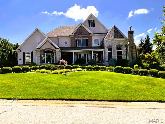 Looking for a new home for the Holidays?  You must see this 1 1/2 story private oasis nestled on a 1.03-acre level lot close to Chesterfield Valley and other shopping, restaurants, and entertainment venues. The 2-story foyer welcomes you with marble flooring and elegant, curved staircase.  The front room can be transformed into a home office, den, library, or whatever your heart desires.  The main floor master bedroom suite with 2 walk-in closets, a sitting room and fireplace (need I say more) is the perfect sanctuary after a long day.  Each of the three upper bedrooms has its own private, full bath and walk-in closets.  Enjoy a soothing view of inground pool and lavish backyard from great room.  The kitchen, which opens into the cozy hearth room, is a chef's delight with a walk-in pantry, newer electric stovetop and downdraft, newer electric convection oven, and microwave.  The finished walk-out lower level is an entertainer's dream with limitless possibilities.  It boasts an extra bedroom, wet bar, kitchenette, media room with built in riser, recreational area(s), double sided fireplace, and plenty of storage space.  The scenic, large, level backyard boasts a patio with pergola, gas tiki torches, gas firepit, inground saline pool for those warm summer days, and a relaxing, soothing hot tub for those chilly nights.  Inground sprinkler system.