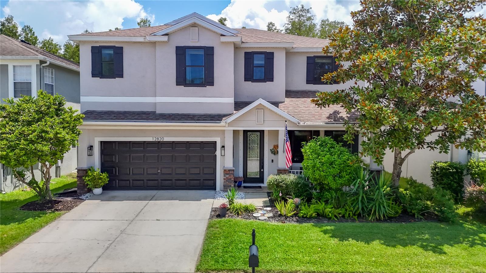 Welcome to this beautiful pool home located in the sought-after gated community of Trinity East. This spacious residence offers 4 bedrooms, 3.5 bathrooms, plus a dedicated office or guest room on the main level, and a 2-car garage. The open concept layout connects the kitchen and family room with expanding patio doors looking out to the lanai/pool area, perfect for entertaining. The kitchen features granite countertops, stainless steel appliances, gas stove, ample cabinet space and a roomy breakfast bar. A convenient first-floor half bath with access to the pool area is perfect for guests, and the upstairs laundry room adds everyday ease with built in cabinets and utility sink. The oversized primary suite is a true retreat with an adjacent sitting area, spacious en suite bath with dual sinks, separate garden tub, roomy shower, and walk-in closet with extra storage area. A secondary bedroom includes its own private en-suite full bathroom and closet. The 2 additional bedrooms include built in closet organizers and share a well appointed full bath as well. Enjoy Florida living on the covered front patio or back yard lanai and screened in pool area overlooking the pool and conservation area with no rear neighbors. The screened in pool area includes a step-up water feature, expansive decking to relax, entertain, and still having plenty of yard to enjoy. Additional highlights include owned solar panels (2023) for lower utility costs, new hurricane-rated windows (2023) for energy efficiency, hurricane shutters, low HOA fees, and no CDD fees. Conveniently located near the community park and playground, State Road 54, Gunn Highway, and the Suncoast Parkway, with easy access to shopping, dining, schools, and Tampa Bay area destinations. A perfect combination of space, comfort, privacy, and efficiency. Don't miss this one!