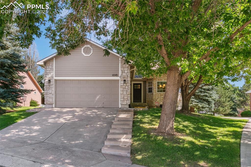 You will love this main-level living open floor plan with lawn maintenance and snow removal taken care of for you!  Open and bright with vaulted ceilings that make the space feel warm and inviting.  Natural hardwood floors stretch through the entry, kitchen and living rooms.  Modern kitchen with quartz counters, large island with cooktop, wall oven/microwave, pantry, and sunny dining area.  Spacious living room with gas fireplace and walk-out to the back patio.  Three main-level bedrooms and two baths, including the primary suite with walk-in closet and well-appointed ensuite bath.  Main-level laundry/mud room with upper storage and utility sink.  Large family room in the basement with built-in storage, and the huge unfinished space with bath rough-in offers workshop space, storage, and a future bedroom/bathroom.  This established neighborhood features beautiful mature trees and is located near Ute Valley Park, grocery shopping, and schools.  Roof, furnace, and carpet all less than 1 year old.