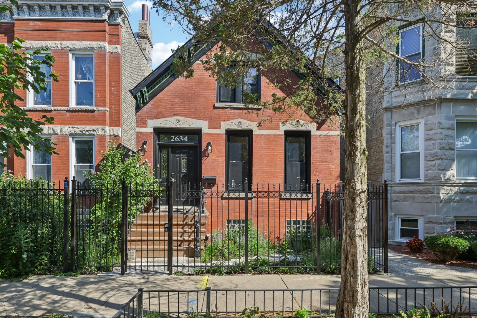 Your Perfect Retreat Awaits! Welcome to 2634 W Haddon Ave, a classic workers' cottage style home walking distance to Humboldt Park!      Step into the bright, open living room featuring gorgeous built-in shelving and cabinets, complemented by large windows that allow natural light to flood the area, and the adjacent formal dining space.   The kitchen stands out with its modern amenities, featuring stainless steel appliances, wooden cabinetry, and sleek countertops.   The flexible family room comes equipped with beautiful French doors.  Upstairs find the bedrooms, including a primary bedroom with a private bathroom, and a fully renovated full bathroom.  Throughout the home, charming details abound, from the hardwood flooring to the stylish light fixtures.   Step outside to the large wooden deck, and the private fenced backyard with a lawn, paver brick patio, and garage. With space for grilling, relaxing, and entertaining, this backyard is a true oasis! The home also features a brand new roof (April 2025) and a green-friendly Induction Stove and Bosch Heat Pump AC unit. With close proximity to Humboldt Park and tons of restaurants and shops, you'll want to make this beautiful home yours. Schedule your showing today!
