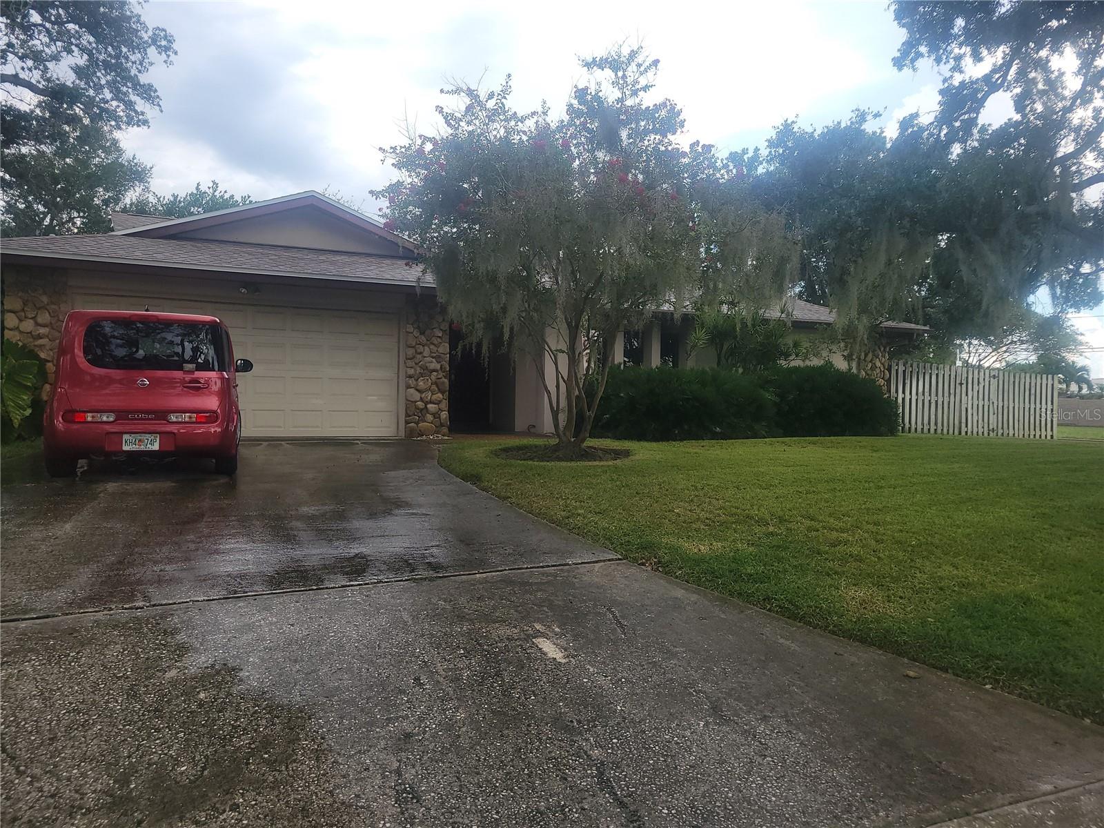 Rare opportunity in highly desirable Bay Hills, where this is currently the only available home in the entire subdivision and one of the largest layouts you will find even in the surrounding neighborhoods! Positioned safely in a non-flood Zone X just 1.5 miles from Indian Rocks Beach, this spacious 4-bedroom, 2-bathroom, 2-car garage pool home offers incredible potential to bring your personal vision, tools, and talent to update the interior and build instant equity. The thoughtfully designed split floor plan features soaring vaulted ceilings, a cozy fireplace, and formal living and dining rooms built for effortless entertaining. At the heart of the home, the expansive chef's kitchen boasts both a center island and a broad breakfast bar, seamlessly connecting to a cozy breakfast area and a massive family room. Double French doors open out to a screened porch overlooking a private tropical backyard oasis complete with a custom swimming pool. The private primary suite features a generous closet and dressing area with a large en-suite bath beyond, while three additional spacious bedrooms and a full guest bath occupy their own separate wing. Complete with an inside laundry room, an oversized garage, and peace of mind knowing the roof and A/C system are both less than four years old, this massive coastal canvas is ready for its modern makeover.