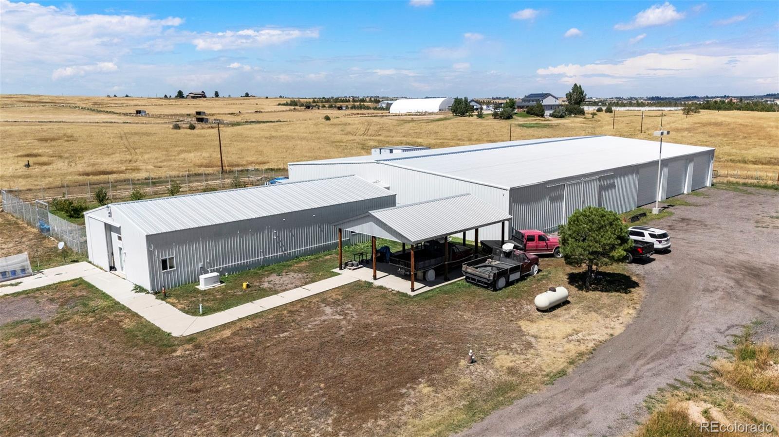 Can I tell you about the house that could actually PAY you to own it? This isn’t your average acreage property. On 35 wide-open acres, you’ll find a solidly built 3-bedroom, 2-bath ranch-style home with 2x6 construction, 5/8” drywall, and 2,592 sq. ft. of practical, no-nonsense living space. But that’s just the beginning. Attached to the home is a 15,000 sq. ft. building, and here’s where things get interesting. A rare zoning variance allows an indoor storage business, and the current rates are about $10 per linear foot. The current owner is already operating a successful storage business, and many of the existing renters want to stay, which means this is a turnkey income opportunity from day one. You can keep the business running as it is, expand it, or reimagine the space entirely. The current owner also uses part of the building for an RV and boat repair shop, and there is an upper-level storage area that could be expanded to generate even more revenue. This property gives you options. You can continue the storage business and add new services. You can live onsite and manage it yourself. You can rent out the house to employees or tenants while focusing on the storage side. Agricultural zoning keeps the possibilities wide open. There is more here than just the business potential. A lofting shed, chicken coop, small orchard, a small shooting range, and a backup generator all add to the property’s appeal. No gimmicks and no fluff, just a unique opportunity for someone who thinks differently. If you are looking for “typical,” this isn’t it. If you have been waiting for the kind of opportunity that lets you live your life your way with built-in income and room to grow, you will want to see this one for yourself.