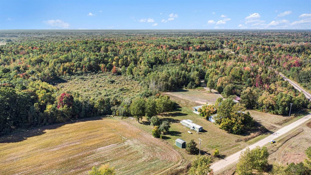 MOTIVATED SELLER! Looking for land that pays you back and gives you the lifestyle you've been dreaming of? Welcome to **1215 Bear Ave in Harrison** -- a versatile **19.4-acre property** that offers **income, privacy, and plenty of room to play. **7 acres of tillable ground is leased**, giving you turnkey income while you enjoy the rest of the property. The balance of the acreage is wooded and ready for hunting, trails, and year-round outdoor fun. On site you'll find a **usable 840 sq. ft. home** plus **multiple outbuildings**, including a **pole barn with a heated man cave** -- perfect for relaxing, entertaining, or working on projects any time of year.Just minutes from Harrison's lakes, ORV trails, and thousands of acres of state land, this property is your gateway to the very best of Northern Michigan living. **Highlights:*** 19.4 acres with income-producing farmland* Heated "man cave" pole barn + multiple outbuildings* Usable home or host guests* Woods, trails & great hunting right out your back door* Close to lakes, town, and public land This isn't just acreage; it's a **lifestyle property**. Whether you're a hunter, hobby farmer, investor, or simply want a Northern Michigan getaway, 1215 Bear Ave is ready for you! Start your up-north life, NOW!