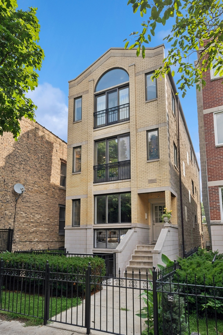 Inviting. Updated. Perfectly Located. Set back from the street in a well-maintained three-unit building, this move-in-ready 2-bedroom, 2-bathroom condo offers a rare combination of charm, thoughtful updates, and walkable convenience in the heart of Lakeview. The stylish kitchen has been recently renovated with elevated finishes, including KraftMaid cabinetry with under cabinet lighting, stainless steel KitchenAid appliances, and a gas stove-ideal for both everyday cooking and entertaining. Sunlight fills the open-concept living and dining areas through large west-facing windows and a French door with Juliet balcony, while a gas fireplace adds warmth and ambiance. Hardwood floors run throughout the home, complemented by timeless crown molding.    The serene primary suite includes a professionally organized closet, private access to a large back deck, and a tranquil en-suite bath featuring a jetted tub. The second bedroom also features custom closet organizers, with additional storage throughout the home to keep life organized and clutter-free. A side-by-side washer and dryer, a large private storage room in the basement, and one garage parking space add everyday ease. Rentals are not allowed per bylaws. All units owner occupied. This self-managed building reflects true pride of ownership, with spotless common areas, regularly maintained walkways, and proactive care. All of this in a prime Lakeview location-just a short walk to the Wellington and Belmont "L" stops, Southport Corridor - Coda Di Volpe, Tuco and Blondie, Crosby's, Gigis, Itoko, Little Goat. Neighbrohood Spots: Wills Northwoods Inn, Farm Bar, Heritage Coffee, Left Coast, Dopio, Ann Sathers, Whole foods, and Target. Truly move-in ready and effortlessly livable-don't miss this exceptional Lakeview opportunity. RENTALS ARE NOT ALLOWED PER BYLAWS.