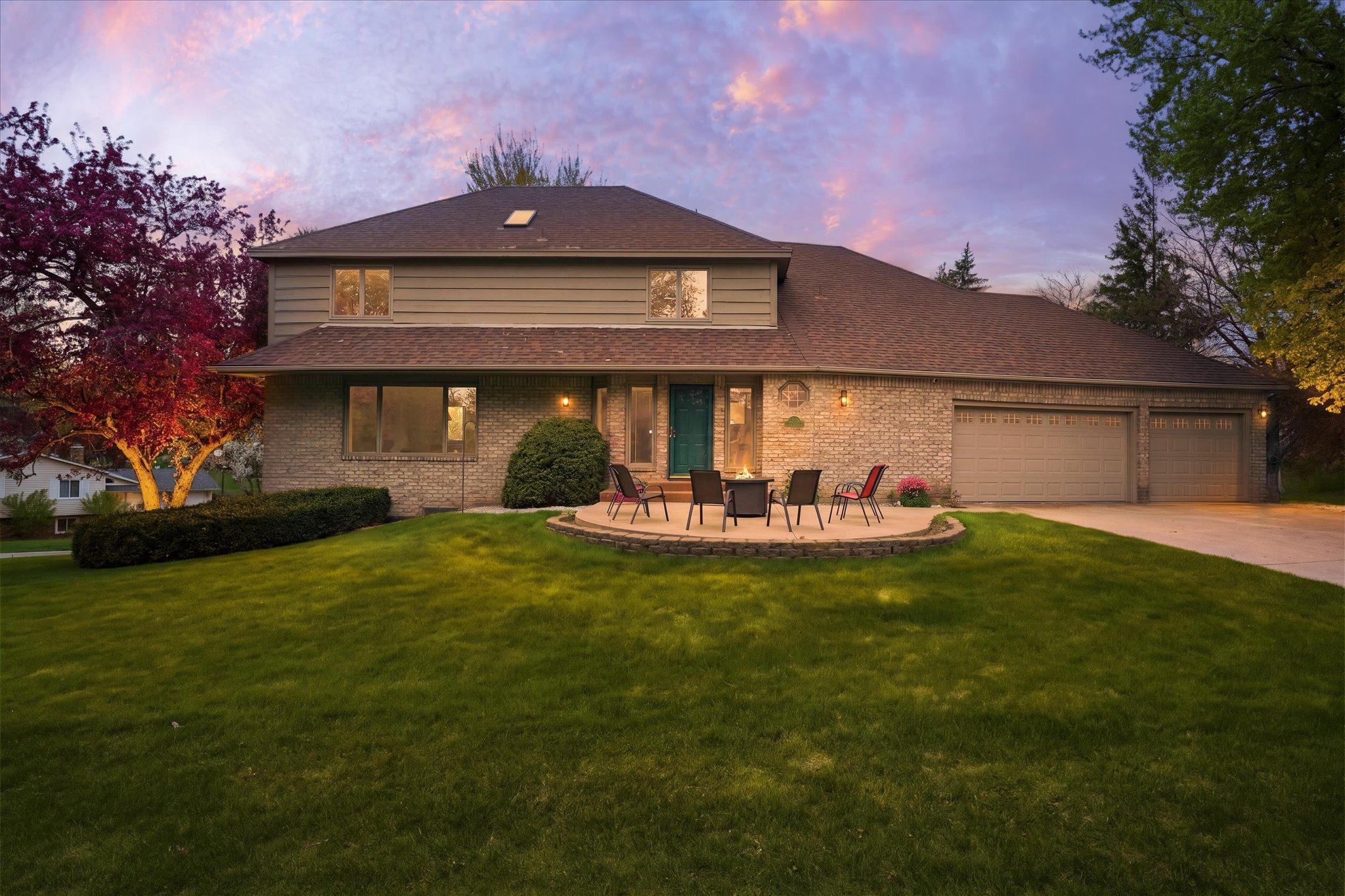 Perched upon a hill on a cul de sac street, this well designed 4,000 sq ft custom built home offers an exceptional location, space, and comfort in an established neighborhood. A welcoming front patio sets the tone, leading into a sun filled home is perfect for both everyday living and large scale entertaining. With a large living room, spacious kitchen, three family rooms, two large decks, and a lower level walkout, there’s room for everyone to spread out and enjoy.At the heart of the home is a sunken family room located just off the kitchen with a dramatic floor to ceiling brick fireplace, creating a warm focal point for gatherings. The layout includes four bedrooms, with three on one level, plus a huge combo mud/main level laundry room for added ease and storage.The primary suite is a true retreat, featuring heated floors, a separate tub and shower, and a walk in closet with a window that fills the space with natural light.Outside, the home continues to impress with a beautiful yard, a 3 1/2  car garage, hardy board siding, and a full sprinkler system for easy maintenance. Surrounded by mature trees and just minutes from restaurants, parks, and shopping, this home is ready to welcome its next owner.