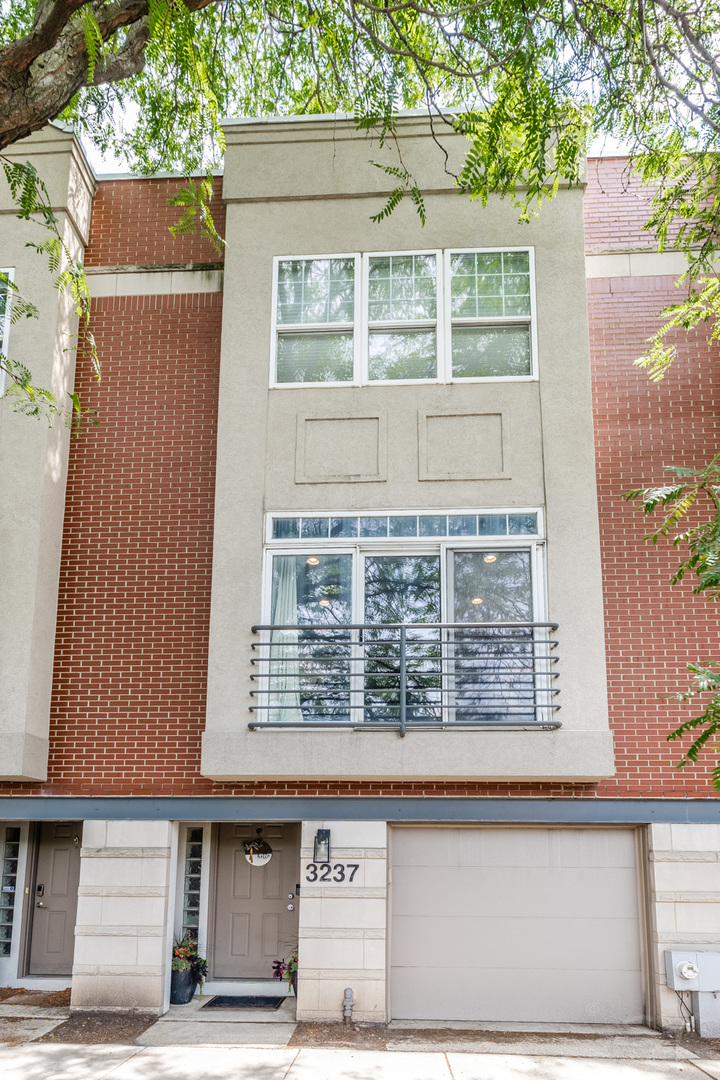 Fabulous townhome located in a prime, 'walkable to everything' location! This turnkey home, which features three private outdoor spaces, has been thoughtfully renovated throughout. The open concept main floor includes ample living, dining and kitchen spaces. The kitchen features stainless steel appliances, quartz countertops, and white cabinetry. The pantry/bar area comes equipped with a beverage fridge and ample storage. The kitchen opens to a deck that's perfect for grilling. The upper level has 2 bedrooms, 1 bathroom and interior access to a private roofdeck! The roof deck is an entertainer's dream, covering the full width and length of the home. This urban oasis was thoughtfully designed using sustainable materials including composite decking and porcelain tiles. It's an amazing space for summer parties, and watching fireworks or the air & water show. The den on the lower level currently serves as a multi-purpose bonus space, but could make a perfect guest room, home office, or additional living room depending on your needs. You'll also love the updated half bath, fenced backyard/blue stone patio area, and attached garage that complete the lower level. This home is perfectly situated on the border of West Lakeview and Roscoe Village, just steps to restaurants, shops, grocery stores, Southport Corridor, parks, and all that this A+ location has to offer.