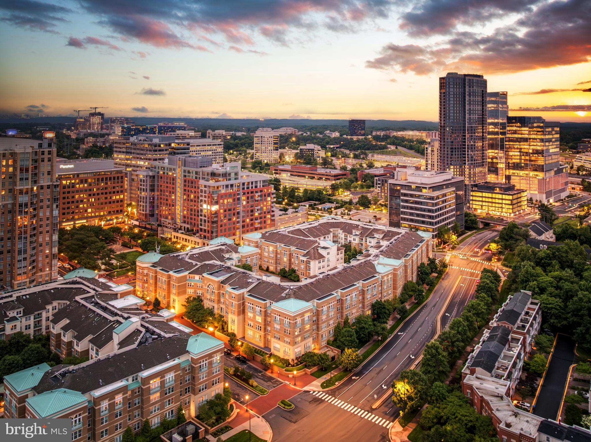 Experience the pinnacle of urban living in this stunning penthouse condo located in the vibrant Reston Town Center. This one-bedroom, one-bathroom unit features a versatile loft, newly installed luxurious vinyl plank flooring, and an updated kitchen equipped with stainless steel appliances and granite countertops along with updated bath featuring spa toned tile and seamless glass shower. The open, light-filled living area boasts large west-facing windows and a Juliet balcony that frames breathtaking views of the Blue Ridge Mountains. Convenience is at your fingertips with easy access to elevators, two assigned parking spaces (559, 560) in the upper level garage close to elevators, and a storage cage (#85). Enjoy the proximity to shopping, dining, and entertainment options, all within walking distance, along with the nearby Metro for easy commuting. Building amenities enhance your lifestyle with a pool, a newly remodeled fitness center, a business center, and a spacious party room with a kitchen,  and Level 2 EV chargers, ensuring every comfort and convenience is just steps away.