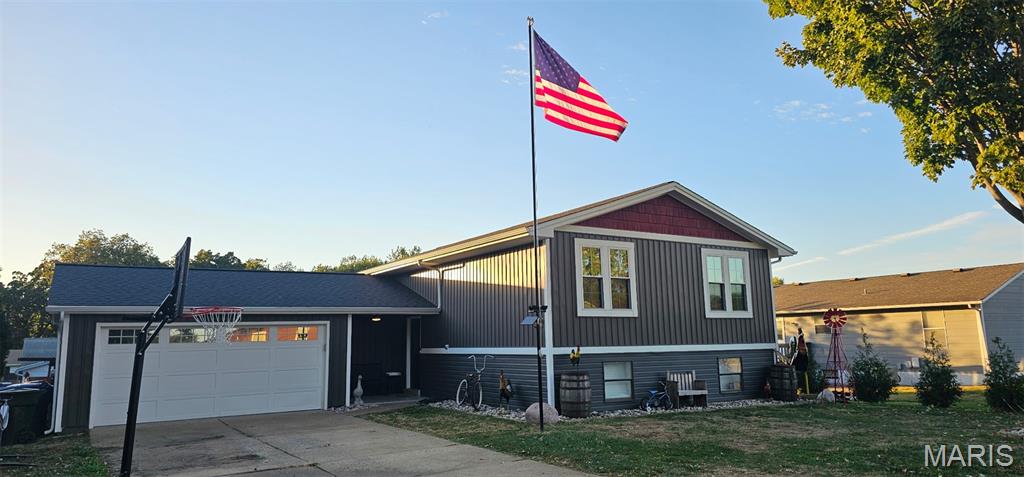 Fully renovated with quality materials and exceptional craftsmanship, this turn-key home checks all the boxes! A decorative glass front door welcomes you into a light, bright foyer with custom shiplap and wrought-iron railing. Hand-scraped mahogany engineered hardwood flooring flows throughout the main level. The spacious family room features a stunning floor-to-ceiling stone gas fireplace, while the kitchen boasts solid mahogany raised-panel cabinetry, abundant storage, and a center island.Enjoy seamless indoor-outdoor living with an 8-foot triple-bifold glass door opening to the NEW 23' x 16' TimberTech composite deck with custom LED downlighting! The primary suite impresses with a HUGE 6' x 6' enclosed luxury shower featuring rain shower and wall sprayers, double vanity with granite countertops, and a walk-in closet with built-in shelving.The climate-controlled garage is a rare bonus, featuring a NEW Bosch HVAC system (2026), fully insulated walls, ceiling and door, separate 200-amp electrical panel, epoxy flooring, metal ceiling with can lighting, and an expanded storage or hangout area.Major updates include high-efficiency furnace and A/C (2023), 50-gallon water heater (2023), newer triple-pane windows, architectural shingle roof (2016), insulated garage door (2022), commercial-style garage opener (2022), and siding updates (2023 & 2026). Stylish finishes, extensive improvements, and incredible indoor-outdoor living make this one a must-see!