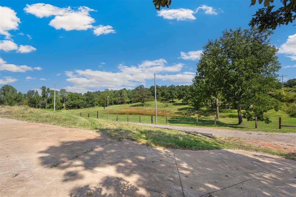 Stunning 10-Acre Hobby Farm just east of the intersection of Hiawassee Road and Memorial Road.
Discover this beautiful 10-acre property featuring a fully barbed wire-fenced perimeter and a 9-foot deep pond. The land is covered in lush Bermuda grass and has been completely cleared of cedar trees, fence line cleared, making it perfect for horses or cattle. There’s a spacious 35'x50' barn with a 10'x50' overhang and a 16' by 40' overhang, two loafing sheds, and a well house that has water and electric. The property also offers two entrances off Memorial and P.H. Road, a garden area, and a turnaround for convenience. With its stunning views and ideal location for a future home, this property is a perfect hobby farm!