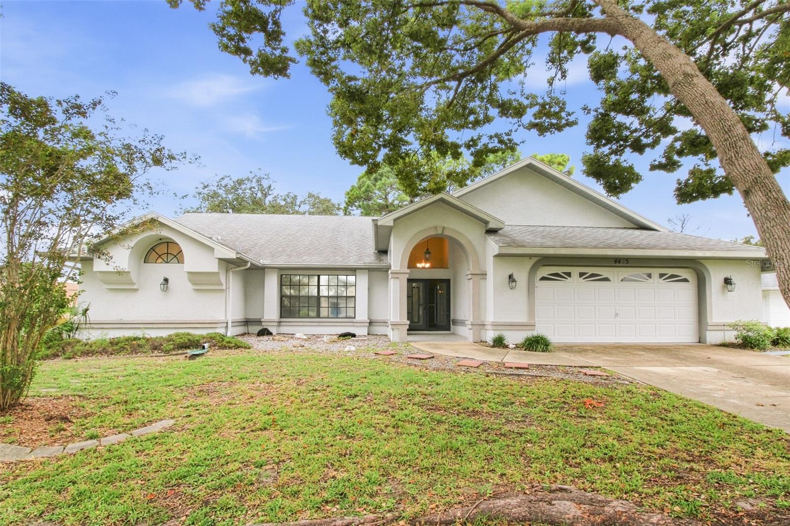 Charm and curb appeal abound for this Spring Hill home! Step inside the inviting foyer and into the well-appointed living room, positioned at the front of the home. Through the dining room you'll find the kitchen, which boasts a 4-piece appliance package, hard surface countertops, and ample storage. This split, ranch style floorplan is rounded out by the family room, the primary suite and two secondary bedrooms. Enjoy your in-ground pool all year long! Come and see for yourself the possibilities that this home has to offer!