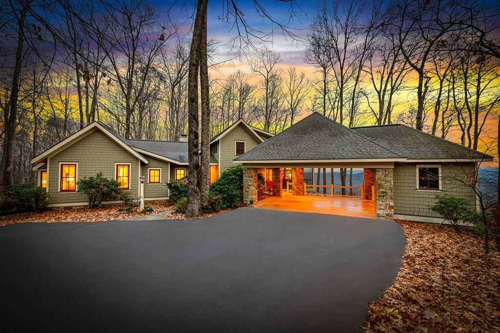 Architect-Owned Luxury Estate 1115 Outlook Dr, Murphy, NC 5 Bedrooms 5.5 Baths 10+ Acres Panoramic Mountain Views Perched atop one of Murphy's most breathtaking vantage points, this architect-designed and architect-owned masterpiece offers an unparalleled blend of luxury, craftsmanship, and natural beauty. Set on 10+ private acres, this five-bedroom, five-and-a-half-bath estate frames sweeping, year-round mountain views from nearly every room-views that feel close enough to touch. Thoughtfully crafted with intention and artistry, the home showcases multiple fireplaces, rich materials, and custom finishes throughout. The heart of the home is the gourmet chef's kitchen, equipped with upscale appliances, generous prep space, and a seamless flow ideal for both intimate meals and large-scale entertaining. Five spacious ensuite bedrooms provide comfort and privacy for family and guests alike, each designed to capture the serenity of the surrounding landscape. Expansive living spaces, soaring ceilings, and walls of glass invite the outdoors in, filling the home with natural light and warmth. Behind the beauty is exceptional performance: a geothermal HVAC system delivers superior comfort and energy efficiency, reflecting the home's commitment to forward-thinking, sustainable design. Outdoors, the property continues to impress-10+ acres of rolling terrain and wooded privacy create a peaceful retreat, while multiple patios and gathering spaces make it easy to take in the endless mountain vistas. A rare opportunity to own an exquisite, architect-designed residence where luxury, efficiency, and the majesty of the Blue Ridge Mountains come together in perfect harmony.