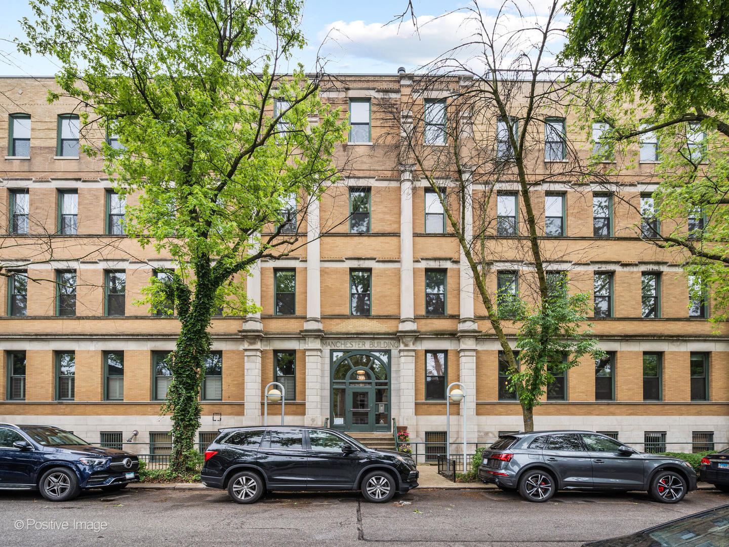 Welcome to this extraordinarily rare 2,669 sq ft brick and timber loft in the heart of the highly coveted Bucktown neighborhood, offering exceptional scale, light, and design with soaring 12-foot ceiling throughout with split floor plan. Situated on a quiet, tree-lined street, this expansive two-bedroom, two-bathroom home-with the flexibility to convert to three bedrooms-seamlessly blends the warmth of industrial architecture with modern luxury.  The centerpiece of this home is a one-of-a-kind, custom-designed Bulthaup kitchen built as a showcase for the brand. A true chef's kitchen perfect for prepping and entertaining.  It features: Sub-Zero integrated refrigerator cabinet with 2 additional Sub-Zero refrigerator drawers & Two Sub-Zero freezer drawers, Gaggenau oven, Gaggenau dishwasher, Miele drop-in conduction electric range. Anchoring the kitchen is an impressive 12.5-foot stainless steel island with a raised butcher block bar with built in cabinetry, perfect for everyday dining and or gatherings. Kitchen also features rolling door cabinets and a set of 3 contemporary, frosted glass cabinets, as well as a walk-in pantry off the kitchen.  A covered private terrace enjoys beautiful morning light, creating a serene spot for outdoor dining and gardening. Easily accessed from either the kitchen or dining room. The expansive open concept living and dining area offers a seamless flow for everyday living. Whether hosting or relaxing, you'll love the generous scale and natural light of this incredible space featuring a wood burning fireplace with art display mantle.   The exposed brick spacious primary suite features two built out walk-in closets, a large 6-foot soaking tub with white tile surround, separate walk-in shower, furniture vanity vessel sink with glass tile backsplash.  The generous second bedroom offers southern exposure, custom organized closets, and a bright, cheerful ambiance ideal as a guest room, home office, or creative space.  Unit comes with a 14 foot by 6-foot walk-in private storage room and an oversized dedicated parking space     New furnace in 2023, air conditioner new in 2020, water heater new in 2022.  15-minute walk to the blue line, 10-minute walk to the 606 Trail.  Blocks to the 90/94.  Exceptional shopping and diverse dining all walkable within blocks.
