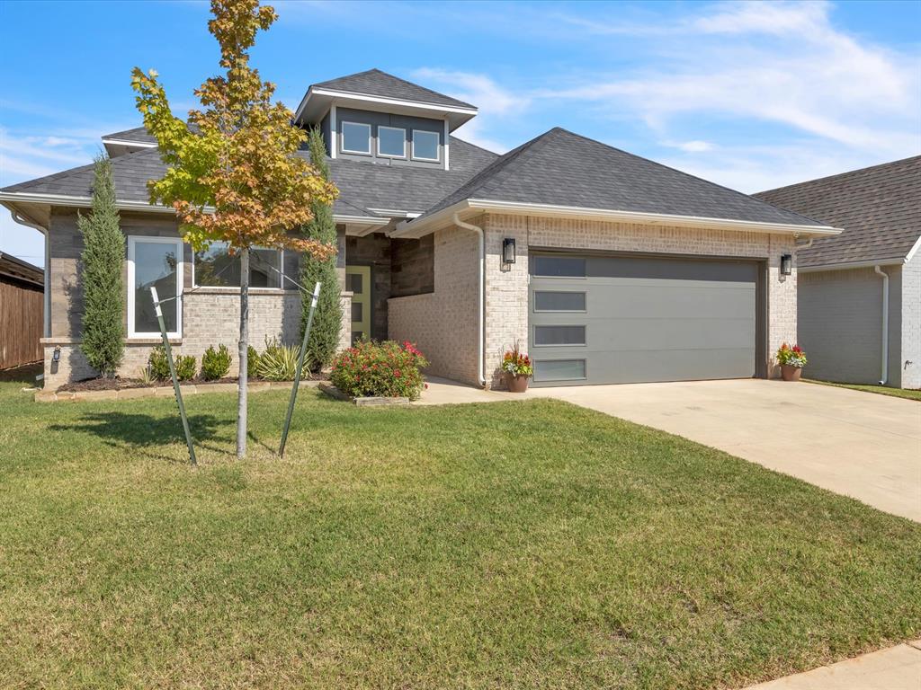 Welcome to 7717 NW 136th Terrace in the sought-after Canyon Lakes community! This stunning home offers 3 bedrooms, 2 baths, a versatile bonus room, and a pocket office with custom built-ins. The open-concept layout features a spacious living room with a beautiful statement fireplace, seamlessly connected to the modern kitchen and dining area. The kitchen is designed for both style and function, complete with a large island, gas range, and plenty of storage.

Enjoy outdoor living on the covered patio overlooking a private backyard with a stone fence—no neighbors directly behind you. The bonus room offers endless possibilities, whether you need a media room, playroom, or home gym.

Additional highlights include a 3-car tandem garage with a Tesla charger and storm shelter.

Canyon Lakes, located in Deer Creek Schools, is one of the most desirable neighborhoods in the area, featuring spring-fed lakes with walking trails, a neighborhood pool and clubhouse perfect for gatherings, a playground, community green spaces, and secure gated entrances.