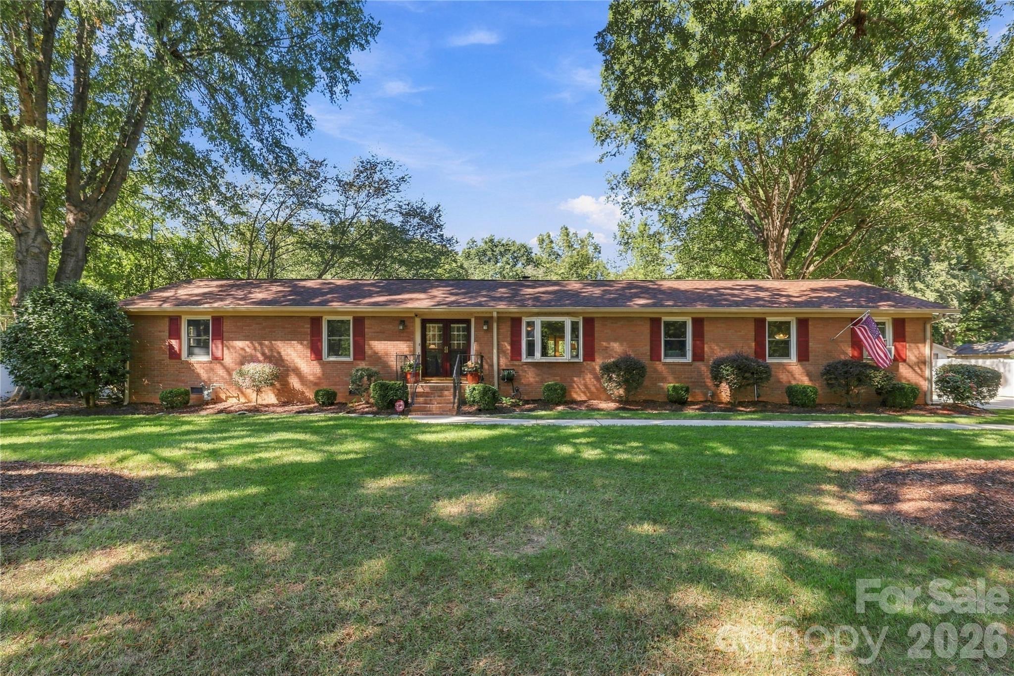 Discover the perfect blend of comfort, space and flexibility in this beautiful all-brick ranch, situated on nearly an acre in the heart of Indian Trail, all with NO HOA! This inviting one-level home features 3 generously sized bedrooms, 2.5 baths and a gorgeous heated and cooled sunroom overlooking the backyard oasis, complete with an irrigation system. Enjoy summer days by the sparkling in-ground pool or entertain on the expansive two-tier deck. Car enthusiasts, hobbyists and those needing extra storage will love the attached 2-car garage, PLUS a detached 785 SF garage/workshop and additional storage shed! Inside, fresh paint and newly refinished hardwood floors in select areas add to the home's appeal. Major updates include HVAC replacement in 2018 and a generator installed in 2021. With nearly an acre to spread out, incredible outdoor living spaces and a prime Indian Trail location, this property offers a rare combination of space, convenience and versatility!