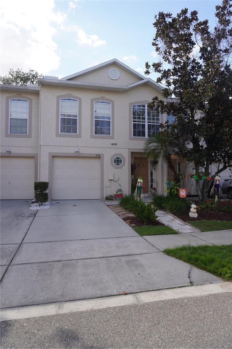 Welcome to Ashburn Square! This well-appointed Maronda-built townhome offers 3 bedrooms, a versatile loft currently used as a 4th bedroom, 2.5 baths, and a 1-car garage. Conveniently located with easy access to Tampa, I-4, Brandon, and Orlando.The first floor features neutral laminate flooring, a spacious living room with a built-in entertainment center, a convenient half bath, and a downstairs laundry closet. The updated kitchen offers solid-surface countertops and top-of-the-line appliances. Enjoy the Florida lifestyle from the screened-in patio overlooking a garden view, with access to a large community green space.Upstairs, a custom staircase leads to a bright landing with a large window and a split-bedroom layout. The primary suite features laminate flooring, an en-suite bath, and a walk-in closet. Two additional bedrooms offer laminate flooring and built-in closets, while the flexible loft provides additional living space.Recent updates include A/C and water heater replaced approximately 4 years ago and garbage disposal replaced approximately 1 year ago. Located in an established community with low HOA fees and community amenities, this home offers a flexible floor plan and convenient access to major roadways. Don't miss this opportunity to make Ashburn Square your new home!