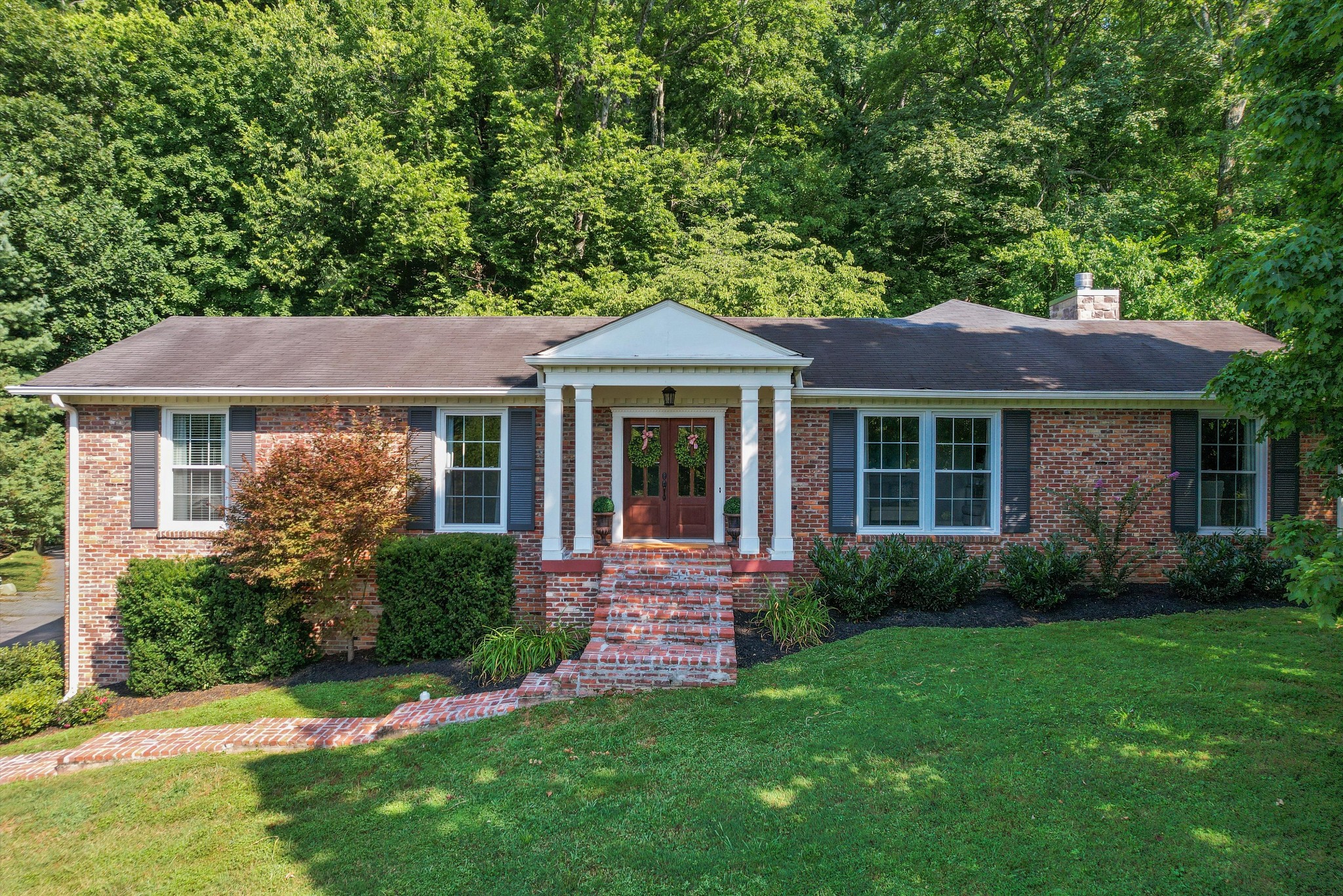 Welcome to 774 Rodney Drive — This isn’t just a home — it’s your next chapter. This classic West Meade home has been reimagined and designed for the way we live today. From the renovated custom kitchen (2021) to spacious living areas, a walkout basement with built-ins, and wet bar ( 2018), to a two-car attached garage, and loads of storage— every detail feels just right. With room to breathe and space to grow, this home offers privacy and flexibility in all the right places.
And this back porch? It's a lifestyle. Newly constructed by the Porch Company in 2023 with no details to spare, this space has a beautiful fireplace, ceiling-mounted heaters, and beautiful flooring. This peaceful home backs up to your private, large, and mature lot, with wooded walking trails, all while being minutes to everything the west side of town has to offer.