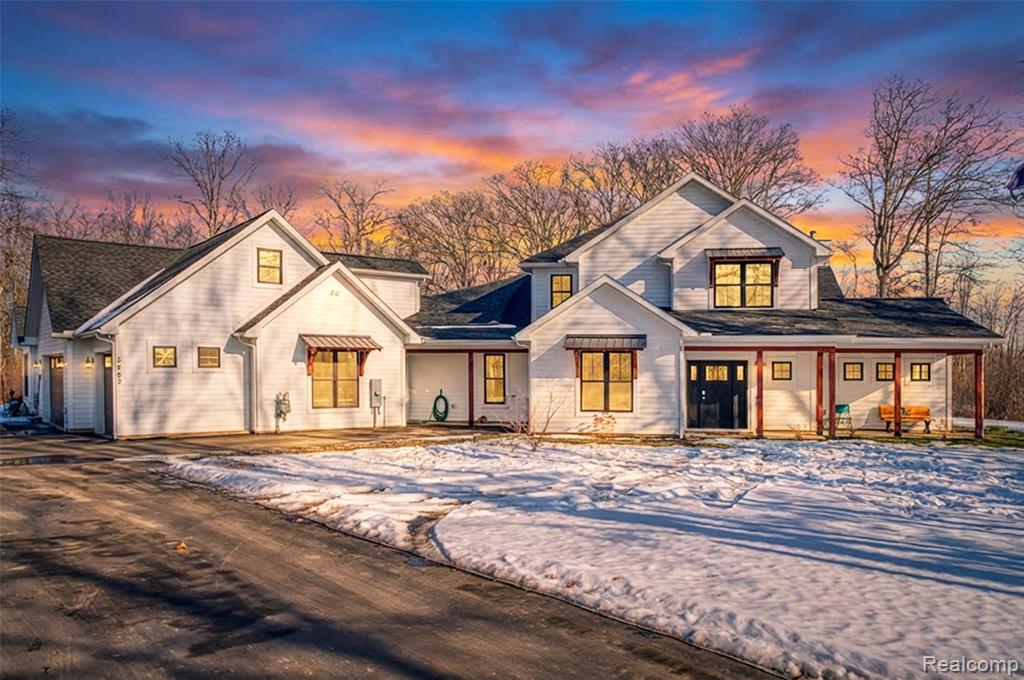 An exceptionally unique opportunity to enjoy both Privacy and Lake Living! Stunning Craftsman style home located on 20 acres of wooded seclusion while still boasting over 450 ft of waterfront on All-Sports Whitewood Lake, part of the Greater Portage Chain of Lakes! The main home features 4 Bedrooms, 3 Full Bathrooms, a two-story Great Room with wood-burning stove, a remarkable Chef's Kitchen with Walk-In Pantry and Coffee Bar Area, In-Floor Heating throughout the first floor, and a Recreation Room that's currently used as a Home Theater but easily could be used as a Play Room or additional Bedroom. Built in 2020, the exterior features Hardie Plank siding and the home features High-Efficiency mechanicals. Additionally, there's an attached 3-Car Garage that leads to the the 2 Bedroom In-Law/Guest Quarters with separate entrance. Your chance for Privacy and room to grow! This land can be split (best location would be a 5 acre or 7 acre split located in the area of the Barn). The vertical cedar-sided Barn/Workshop with lean-to also features two 10 ft overhead doors, a two-story loft area, indoor golf simulator, concrete, and is currently heated with wood & propane and uses solar power for electricity.