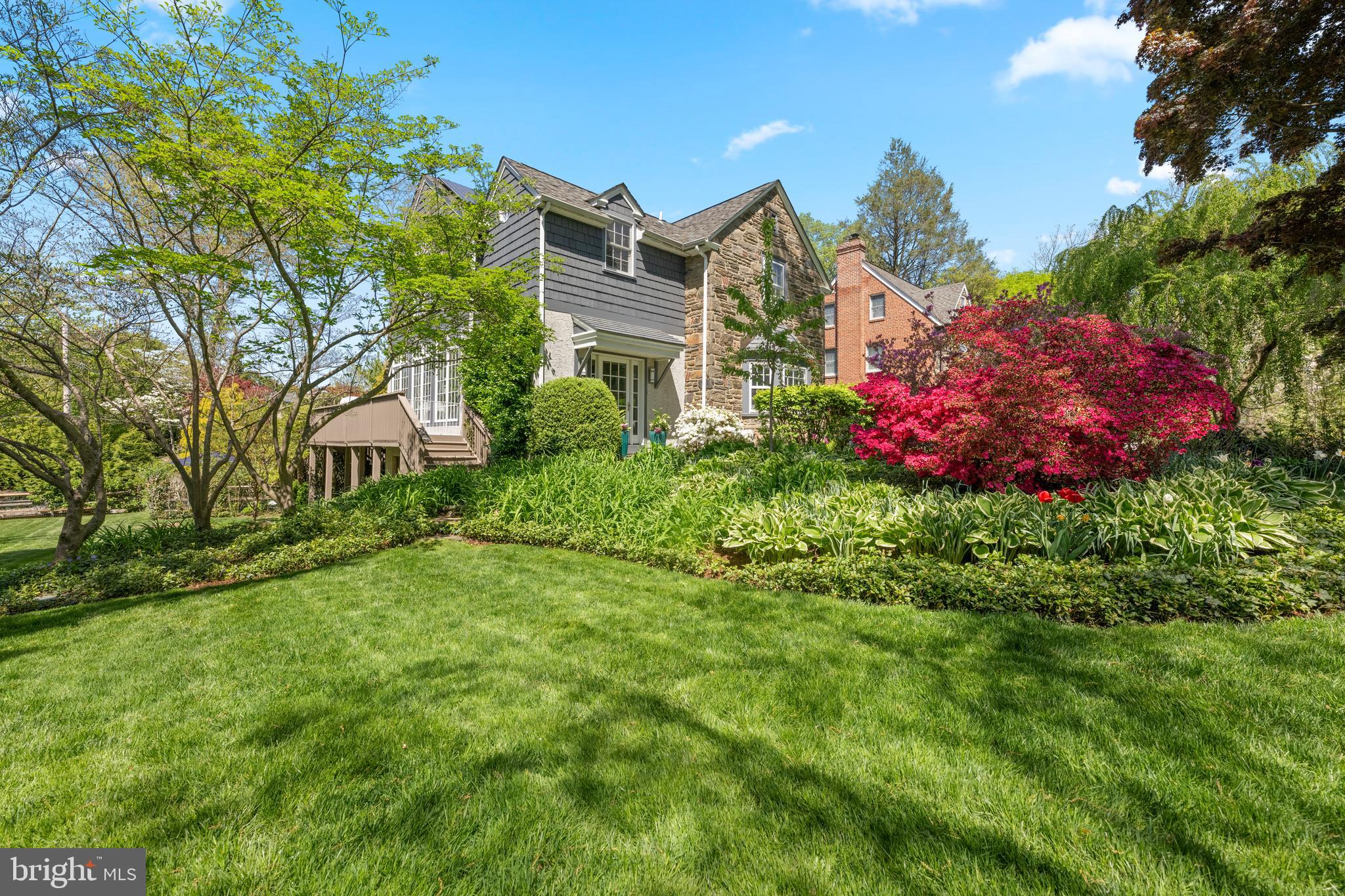 Welcome to 19 Derwen Road in the heart of Bala Cynwyd—an elegant and timeless stone Colonial set on a beautifully landscaped . 40-acre lot. This exceptional home offers 4 spacious bedrooms, 3 full bathrooms, and 2 half bathrooms, blending classic architecture with thoughtful modern updates including a two-story addition. From the moment you arrive, the meticulously manicured grounds create a stunning first impression. The backyard is a true private retreat, featuring a sparkling heated gunite in-ground pool and expansive stone patio—ideal for outdoor entertaining, summer gatherings, or quiet relaxation. Inside, the home is equally impressive. A formal living room offers gathering space with a classic wood-burning fireplace encased in natural stone and a deep bay window surrounded by built-in shelving overlooking the manicured landscaping. The inviting family room is filled with natural light from beautiful windows overlooking the lush side yard and features a cozy gas fireplace. This spills into the dining room leading into the updated kitchen designed for both everyday living and entertaining, complete with heated floors, a 5-burner gas stove, Viking hood, Sub-Zero refrigerator, Wolf oven, and built-in microwave. French doors lead to the deck just off the kitchen providing the perfect space for al fresco dining. The first floor showcases hardwood and tiled floors throughout most of the space, enhancing the home’s warmth and character. Rounding out the first floor is a versatile mudroom with space for a home office, along with a convenient powder room and laundry room. Upstairs, the primary suite serves as a true retreat with a private ensuite bath and grand vaulted ceilings. Two of the additional bedrooms are connected by a Jack and Jill bathroom, while the fourth bedroom offers its own unique charm with access to a cozy outdoor terrace—perfect for morning coffee. The partially finished basement offers flexible additional living space—perfect for a playroom, gym, or media area—and features a second wood-burning fireplace encased in natural stone, creating a warm and inviting atmosphere. Additional storage and a two-car garage complete this exceptional home. Ideally located within the award-winning Lower Merion School District, this home is walkable to Cynwyd Elementary, Bala Cynwyd Middle School, and the Cynwyd Heritage Trail. Enjoy the convenience of nearby shops and restaurants in Bala and Merion, with just a short drive to downtown Narberth, Manayunk, and Suburban Square. Commuters will appreciate the quick and easy access to Center City, making this home the perfect blend of suburban tranquility and urban accessibility. With its prime location, thoughtful updates, and beautiful indoor-outdoor living spaces, 19 Derwen Road presents a rare opportunity to own a truly special home in Bala Cynwyd.