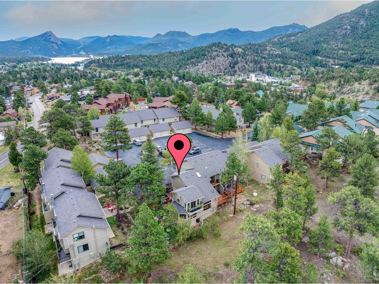 If you think you know Lewiston Condos, this one will surprise you! Extensively remodeled and thoughtfully reimagined with custom details throughout, this distinctive residence stands apart with a level of craftsmanship and character that places it in a class of its own, both within Lewiston Condos and among condo offerings throughout Estes Park. Inside, carefully selected finishes and extensive upgrades create a warm, sophisticated mountain retreat. The beautifully remodeled gourmet kitchen serves as the heart of the home. Just beyond, the spacious dining area becomes a destination of its own, with a gas fireplace and large picture window framing the peaceful, private views. The inviting living area features a dedicated bar, providing another welcoming space for entertaining. What truly sets this property apart is what awaits outside. The private patio feels like an extension of the home, an impressive outdoor living space for relaxing, entertaining, and enjoying the mountain surroundings. Thoughtfully placed accent lighting brings the patio to life in the evening and creates a memorable atmosphere for unwinding under the stars. Just steps from the patio, the association's shared common area includes a firepit, offering residents another inviting place to gather.Excellent privacy, a whole-house fan for summer comfort, and extensive custom improvements add to the appeal. This is far from an ordinary Lewiston condo. Photos only begin to tell the story. Experience the thoughtful craftsmanship, custom finishes, and exceptional indoor-outdoor living for yourself.
