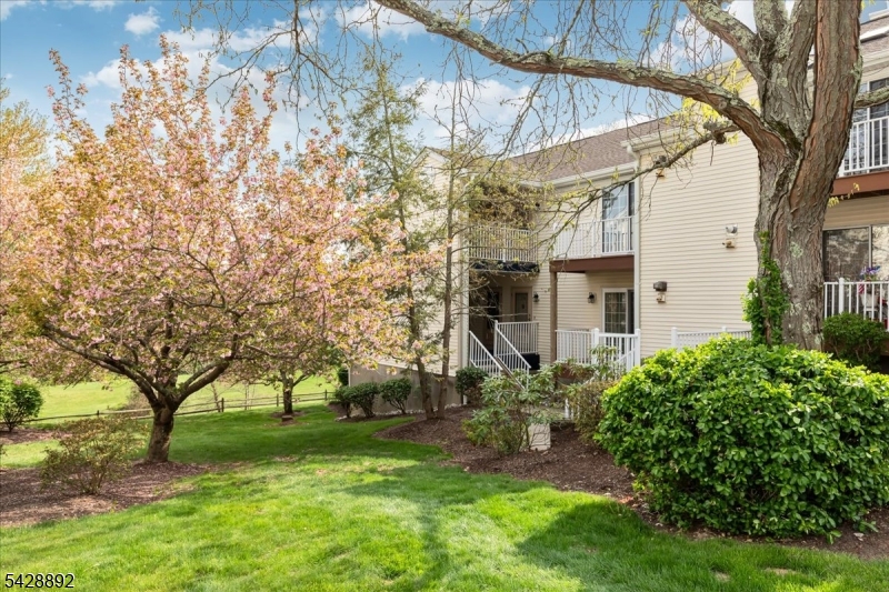 Welcome to the highly desirable Spring Ridge community in Basking Ridge, known for its top-rated school district. This beautifully updated Ardsley model offers ground-level living with a spacious walk-out patio in Madison Village. This stylish home features an open-floor plan filled with natural light, connecting the living and dining areas. The remodeled kitchen showcases modern finishes, quartz countertops, tile flooring, a peninsula breakfast bar, and ample pantry storage, perfect for everyday living and entertaining. The updated bathroom provides a spa-like retreat with quartz counters and elegant tilework. The spacious bedroom includes a large closet and direct access to the bath for added convenience. Enjoy an in-unit washer and dryer, assigned parking, and ample guest parking. Step outside to your private patio and take in serene views of lush greenery. Residents benefit from an on-site community manager, playground, tennis courts, clubhouse, bicycle/walking paths, an inground pool, and bocce courts. This 326-acre, beautifully maintained community is adjacent to over 100 acres of preserved natural land, offering a peaceful, wooded setting. A commuter?s dream, close to shopping, medical facilities, restaurants, major highways, and to NYC transportation. Explore nearby recreation such as the Somerset Hills YMCA & the JCC in Bridgewater, along with Somerset County parks including Lord Stirling Park, Colonial Park, Washington Valley Park, & the Sourland Mountain Preserve.