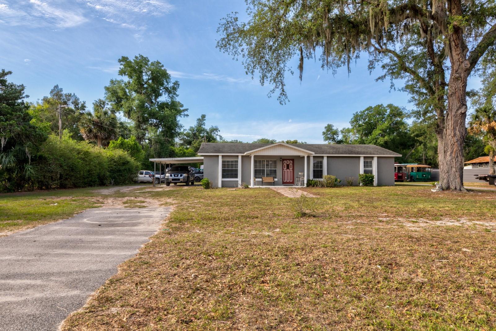 Discover a unique live-work opportunity on over 1 acre of land with the comfort of a well-maintained 3-bedroom, 2-bath home and the bonus of a fully equipped 20×50 shop plus a wrecker included. This property blends everyday living with exceptional functionality, offering space, privacy, and room to grow. The home features an inviting open floor plan that flows from the front entry into a nicely updated kitchen, perfect for gatherings and daily living. Recent improvements include a new A/C system and new drainfield, giving you peace of mind and modern efficiency. The layout works beautifully for families, multi-generational living, or anyone who wants extra room to spread out. For hobbyists, collectors, or those who simply want incredible storage and workspace, the turn-key shop is a standout. Complete with a lift, tools, air system, and an office with additional storage above, it’s ideal for car enthusiasts, woodworking, home-based businesses, or creative projects. The included wrecker adds even more versatility for those who need it. The fully fenced yard offers privacy and security, with multiple storage areas and a large toy hauler already on site. Whether you envision a garden, equipment storage, a play area, or space for recreational vehicles, there’s room for it all. This property offers the rare chance to live comfortably while enjoying the freedom of space, storage, and on-site work potential. Whether you’re seeking a peaceful homestead, a place to run your passions, or a combination of both this one delivers. Come explore the possibilities and see how this property can fit your lifestyle.