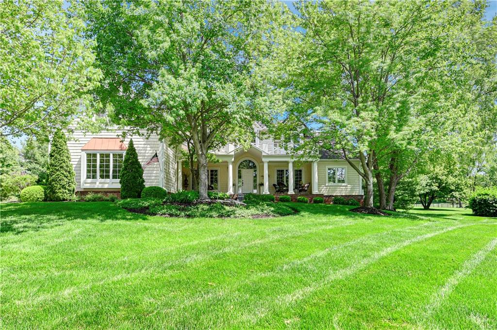 Welcome to this Stunning updated home in the Beautiful gated community of Loch Lloyd. The charming front porch sets the stage for this well maintained 1.5 story featuring 5 spacious bedrooms and 5.5 bathrooms.The main floor is an entertainers dream with a gourmet kitchen & charming hearth room opening up to both a covered & uncovered patio complete with heaters, fireplace, grill and more. Home is light and airy with loads of windows and hardwood throughout the main level and upstairs.The large primary suite includes a tranquil spa-like bath. Main floor includes dining room, living room and a private office. Upstairs offers 4 generous sized guest rooms. 2 have private baths and the other a Jack & Jill bath. Lower Level is a retreat offering media and game areas along with a kitchen, family room and full bath as well as ample storage. Loch Lloyd provides a resort like lifestyle and home is a MUST SEE!