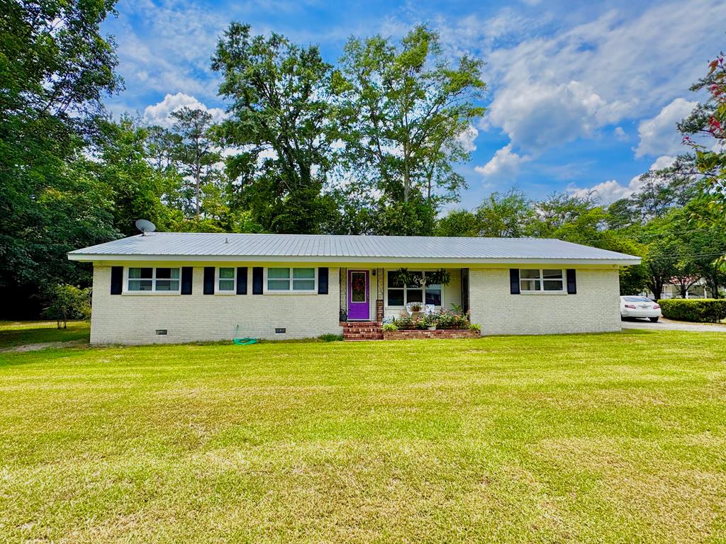 This newly remodeled home boasts numerous excellent finishing touches. One of its standout features is its location on a cul-de-sac, providing a serene environment with minimal traffic and no homeowners association.  Imagine living in a peaceful home where you won't have to worry about vehicles constantly moving up and down the street at all hours. This home is an ideal choice for retirees who desire proximity to downtown, the YMCA, shops, doctors, and other amenities. It's also perfect for anyone in between.  Other notable features include a brick fireplace with gas logs, a spacious living room, a cozy den, and a newly remodeled kitchen with luxurious vinyl flooring. There are also some unique features to enjoy, such as a large yard and a charming brick patio. Additionally, the home comes with a new roof and updated appliances.
