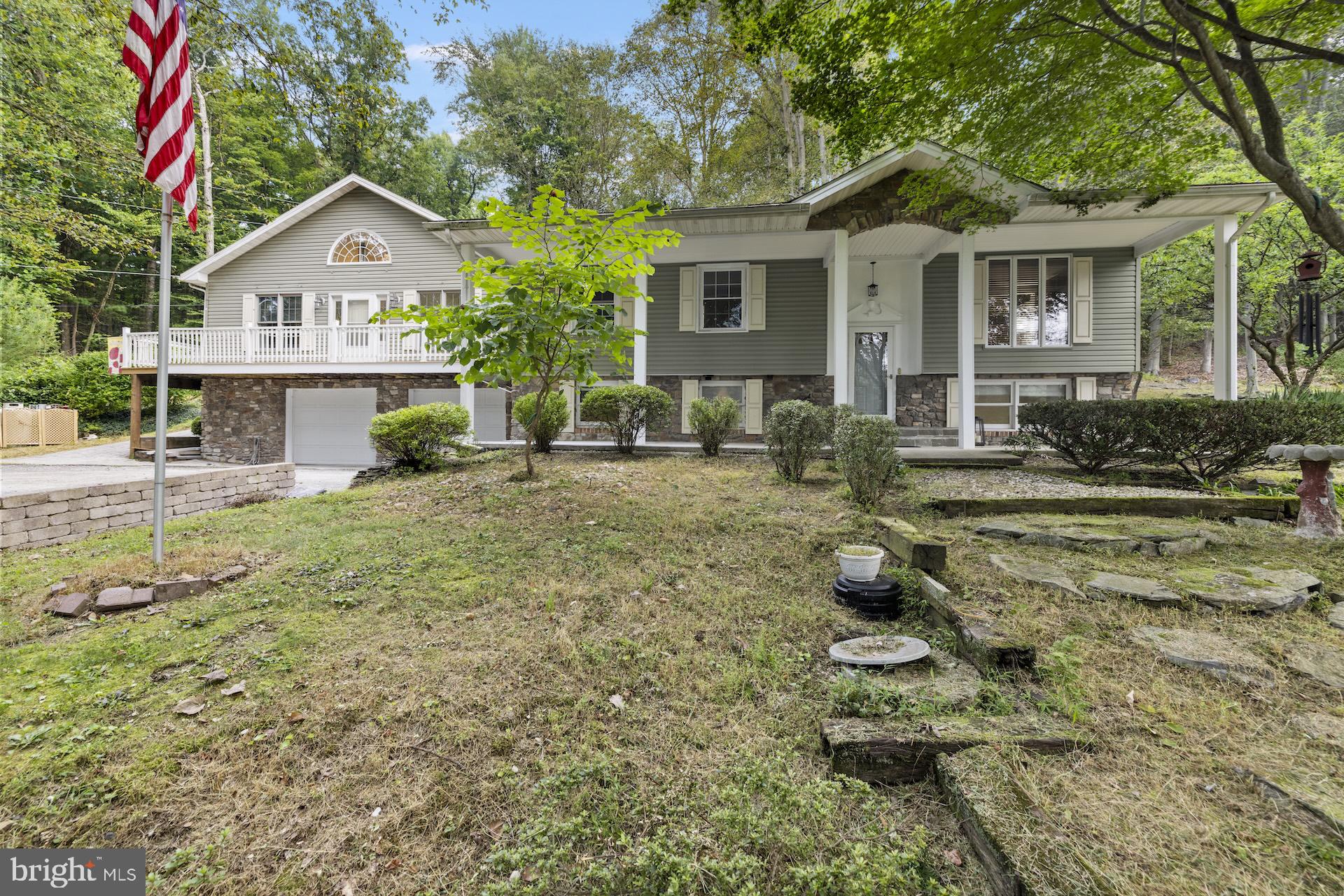 Private Retreat Near Liberty Mountain – In-Law Suite, Salon Potential & Outdoor OasisWelcome to this unique modified bilevel nestled in a private setting just minutes from Liberty Mountain Resort, where you can enjoy golfing in the summer and skiing in the winter—the best of all seasons right at your doorstep.This versatile home features 3 bedrooms, 2 full bathrooms, and a half bath, offering a smart layout perfect for families or multi-generational living. The in-law suite provides private accommodations for guests or extended family, while the spacious oversized 2-car garage adds plenty of room for vehicles, storage, or hobby space.  Most of the flooring on the main level has just been replacedOutdoor enthusiasts will love the extensive entertainment area, ideal for gatherings or peaceful evenings surrounded by abundant wildlife. A whole-house generator ensures year-round comfort and peace of mind.Looking to work from home? The property offers great potential for a barber shop or salon, blending residential charm with small business functionality.Whether you're seeking a weekend escape, full-time residence, or investment opportunity near four-season recreation, this one-of-a-kind property delivers flexibility, privacy, and potential in a stunning natural setting.