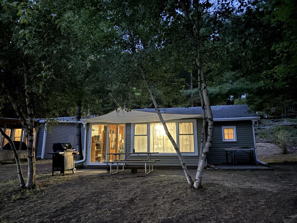 Buy now and enjoy the fall colors and be ready for ice fishing this winter.  This cozy lakefront cottage features two bedrooms and an open floor plan. The property includes 40 feet of frontage on no wake Bertha Lake. The cottage could be used year-round with the wood burner and wall furnace. Recent updates within the past few months include a new well, updated staircase from the driveway down to the cottage, new carpeting in the bedrooms, new lighting, and a new sliding door, among other improvements.  This one is a must see.