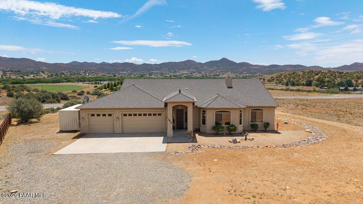 Welcome to Prescott Dells Ranches! Take in breathtaking panoramic views...from mornings with stunning sunrises streaming into the open-concept kitchen and gathering spaces, or evenings watching spectacular Arizona sunsets paint the sky in vibrant shades of pink, purple, and orange through the living room windows.The outdoor living experience is equally impressive. Relax on the back patio while enjoying dramatic monsoon thunderstorms rolling across the horizon, or unwind as the clear blue sky transitions into a beautiful desert twilight.This great location offers country living while remaining close to shopping, dining, and local conveniences. Outdoor enthusiasts will love the easy access to miles of scenic back roads, perfect for mountain biking, ATV adventures, and exploring Arizona's natural beauty right from your doorstep.The spacious garage features a bonus third bay with extra depth, providing ample room for recreational vehicles, toys, storage, or a dedicated workshop. And the fenced backyard is a perfect spot for pets, with corrugated metal fencing between this home and the neighbor for added privacy. Located close to Hwy 69 for easy access to Hwy 169 to Sedona and Verde Valley, and just 80 miles from Phoenix and 30 minutes to Prescott.Whether you're seeking adventure, stunning views, or just a great place to call home, this exceptional property delivers it all.NEW ROOF BEING INSTALLED MID SEPTEMBER!