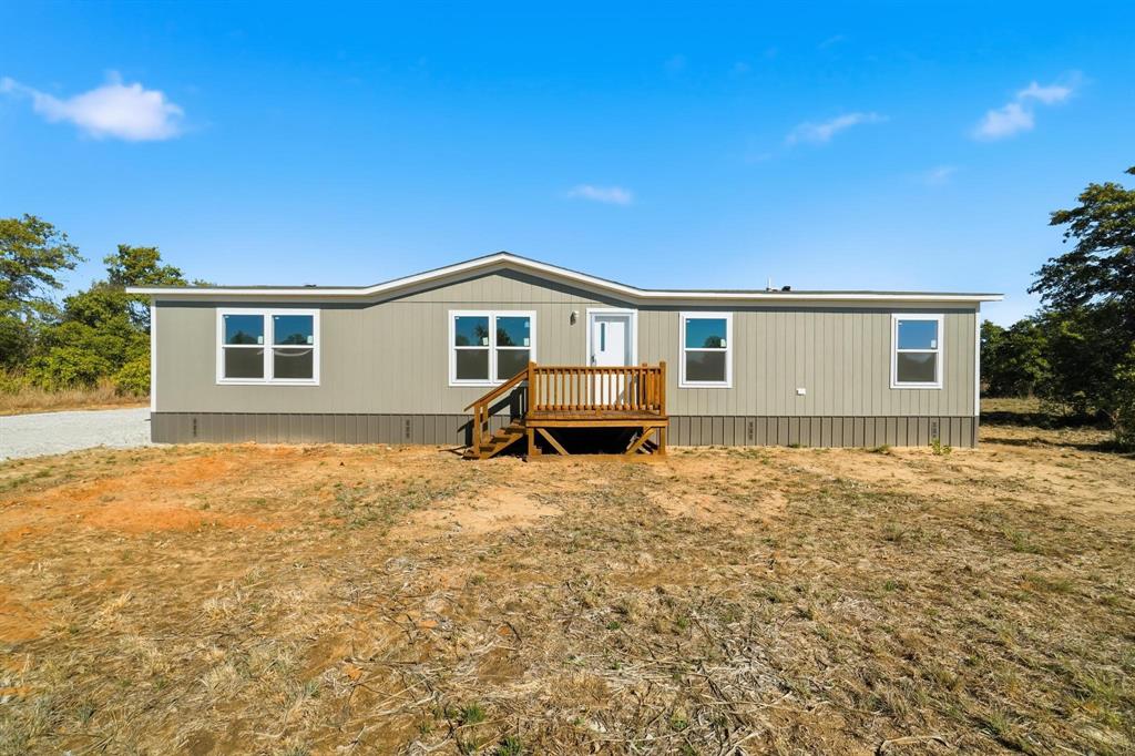 View of front of property with a deck