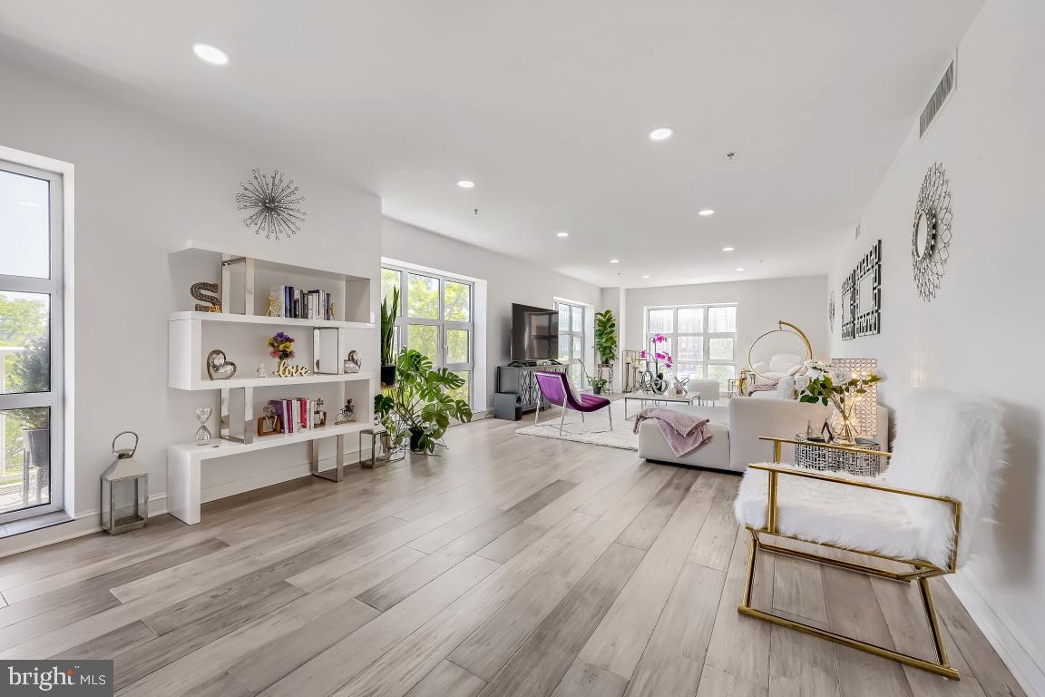 This two bedroom unit , originally a three bedroom, has been customized to maximize the corner views and living room space while still offering second bedroom/den/office.   A light color palette emphasizes the abundant light and open space.   All mechanicals, including HVAC and water heater are new with this renovation.   A formal, elegant double door entry opens onto a wide foyer with a contemporary remodeled kitchen with upgraded countertops and stainless appliances.  The breakfast bar overlooks a spacious dining area, and just beyond, french doors lead to a large eastern facing balcony.   A series of oversized windows frame snapshots from historic Little Italy all the way to the sparkling towers of Harbor East.  In the primary suite, occupants are spoiled with a giant walk-in closet, a set of french doors leading to a covered terrace with harbor and city views, and a sumptuously renovated bath with walk-in shower.   Lots of closet/storage space and garage parking for one car included.  Enjoy the Indoor pool, sundeck, fitness center, community room, resident library, game room, and 24-hour staffed front desk .  Our on-site real estate office will  facilitate all viewings.  Call us for a tour.
