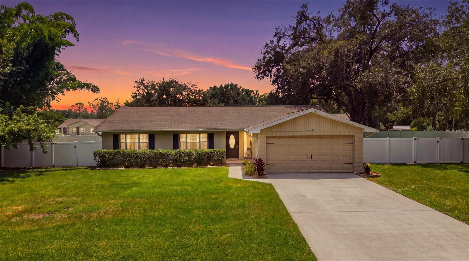 Welcome to this beautifully updated 4-bedroom, 2-bath home in desirable Lake Padgett Estates, situated on approximately 1/4 acre fenced in 2026 with vinyl.  The backyard offers plenty of room for entertaining, pets, play, or creating your own outdoor retreat. Inside, the home offers a fresh, inviting feel with updated tile flooring, along with interior paint completed in 2020/2021. The kitchen has been thoughtfully updated with attractive finishes and a stylish mounted vent hood, while the bathrooms feature beautifully updated fixtures and finishes that add to the home's refreshed appeal. The sellers have continued to invest in the property with a new roof installed in March 2022, gutters added around 2018, replacement of the A/C system in 2020.   With four bedrooms, two full baths, numerous updates, and a generous homesite, this property offers a wonderful combination of comfort, functionality, and value. Enjoy the lifestyle and convenience that make Lake Padgett Estates such a popular Land O’ Lakes community. Residents enjoy an impressive array of amenities, including a community clubhouse with restaurant/bar, resort-style pool, fitness room and rentable event space, along with tennis, basketball, pickleball and racquetball courts, a jogging track, batting cage, playground, picnic area and dog park. On-site management staff adds another level of convenience for residents. The community offers a low HOA and NO CDD.  Lake Padgett area is known for its established surroundings and abundance of recreational opportunities. The location also provides convenient access to I-75, I-275, US-41 and the Suncoast Parkway, with State Roads 54 and 56 nearby, making travel throughout Tampa Bay convenient. Shopping, dining, schools, recreation and everyday necessities are all within easy reach. With its approximately 1/4-acre fenced homesite, updated interior, major system improvements, extensive community amenities and convenient location, this home offers an excellent opportunity to enjoy the Land O’ Lakes lifestyle. This is a remediated property with previous sinkhole/stabilization work completed, and reports are available for buyer review. Buyers are encouraged to review the available engineering documentation and reports as part of their due diligence.  Insurance policy is available for property coverage and quotes have been obtained for prospective buyers.
