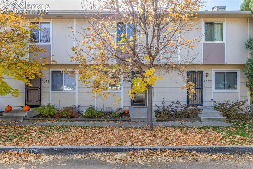 Welcome Home to this charming 2-bedroom, 2-bath townhouse ideally situated on a quiet cul-de-sac! Central location close to shopping, dining, and major conveniences! This inviting home features an assigned driveway and street parking for easy access. Inside, enjoy large, spacious bedrooms, a laundry closet with a full-size washer and dryer included, and a cozy wood-burning fireplace that adds warmth and character to the living area. The kitchen offers plenty of storage with a pantry, built-in appliances, and ample counter space. The back deck with a storage room is perfect for relaxing and enjoying your morning coffee in privacy. Just minutes from Downtown Colorado Springs! A wonderful blend of comfort and convenience!