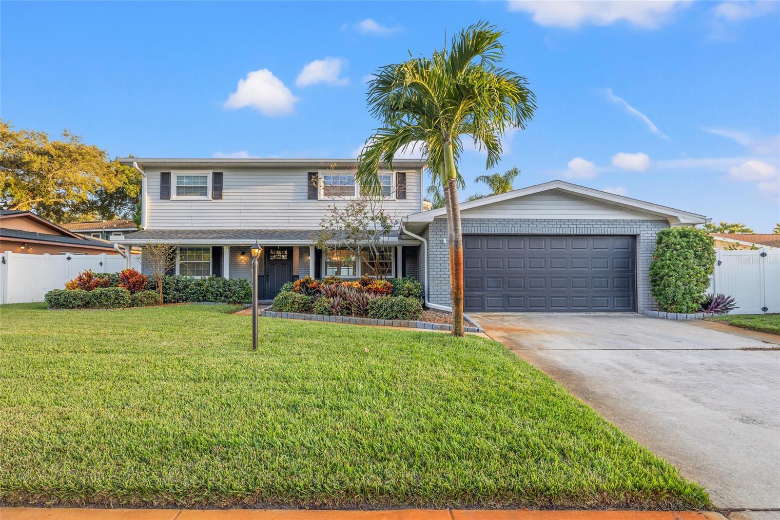 Welcome to this beautifully maintained, move-in-ready 4-bedroom, 3-bathroom, two-story, pool home in the desirable Oak Park subdivision! Offering 2,046 sq. ft. of living space, a 2-car garage, and a fantastic backyard retreat, this home is perfect for families and entertaining. Located in unincorporated Largo with NO HOA and NO FLOOD ZONE.The spacious backyard features a heated swimming pool, low-maintenance turf, and a playset that conveys with the home, providing plenty of room for both relaxation and play. There is a screened in back porch creating additional outdoor living space where you can fully enjoy the Florida lifestyle. *The pool deck and front and rear patio cement floors have been freshly painted.Inside, the home features luxury plank vinyl flooring throughout, with carpet in the bedrooms. The Primary bedroom and bath is conveniently located on the first floor.  The updated kitchen and all bathrooms offer modern finishes and have been thoughtfully maintained. The interior has been freshly painted throughout, creating a bright, clean, move-in-ready feel. The kitchen and downstairs bathroom faucets have also been recently replaced. There is also a large indoor laundry room directly off the garage.Additional features include two HVAC systems—one replaced in 2016 and the other in 2021—plus a split AC unit in the primary bedroom for additional cooling and comfort. The roof and water heater were both replaced in 2020.With its spacious floor plan, updated features, private backyard, heated pool, and convenient location, this is an ideal family home ready for its next owners!