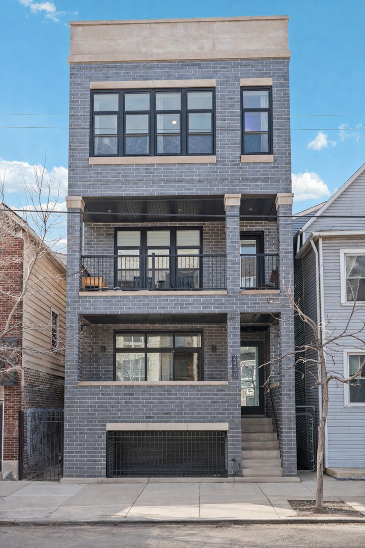 Say hello to this stunning newer construction residence (2022) offering the perfect combination of luxury, functionality, and unbeatable outdoor living in the on the border of the Bucktown & Logan Square neighborhood. 3 Bed/2.5 Bath Duplex Up with Private Rooftop. This home features a thoughtfully designed open concept layout with generous room sizes, tons of natural light, and elevated finishes throughout. The updated kitchen is a standout with Quartz countertops, High end Bosche stainless steel appliances, Coffee bar, and a large island. Living room features a gas starting fire place, gorgeous hardwood flooring throughout, in-unit W/D, and carpeted bedrooms for added comfort. HVAC, Water Heater, W/D are all 2022. The primary suite has a walk in closet, spa-like bath featuring a double vanity and large shower with body jets. What truly sets this home apart is the private outdoor rooftop deck, featuring incredible skyline & sunset views, a rare and impressive extension of the living space, ideal for entertaining or relaxing above the city. Rooftop decking is surrounded by vibrant real greenery planters that brighten up the space. On the same level a wet bar, beverage refrigerator, and a half bath for extra convenience. An attached garage parking space is included! Located in Bucktown and bordering the Logan Square neighborhood you get the best of both worlds. Close access to the highway and situated near some of these neighborhoods' top dining, shopping, coffee shops, nightlife, CTA and Blue Line access.