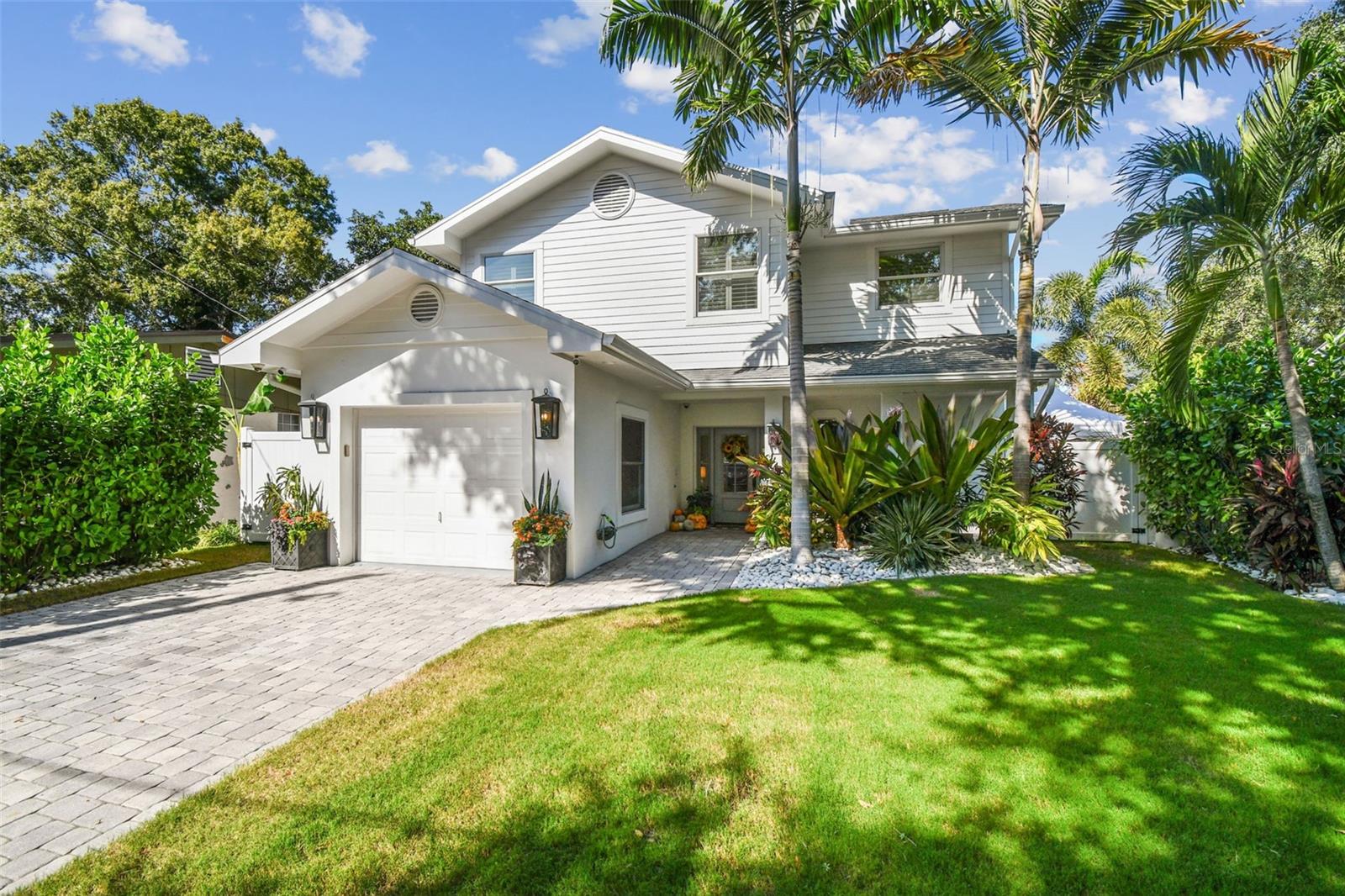 Under contract-accepting backup offers. Experience the best of South Tampa living in this stunning custom Palma Ceia home, where timeless design, quality craftsmanship, and effortless indoor-outdoor living come together.
Thoughtfully updated and meticulously maintained by the owners, this home reflects comfort, care, and pride of ownership throughout. From the inviting front porch to the resort-style backyard, every space is designed for relaxation and connection. Enjoy quiet evenings under the palms or host unforgettable gatherings in your private outdoor oasis.
Inside, the open kitchen features new Cambria quartz countertops, a breakfast bar, stainless steel appliances, a gas cooktop, and abundant custom cabinetry. Throughout the home, you will find new engineered hardwood floors, plantation shutters on every window, crown molding, and a dedicated laundry room, all combining luxury with everyday ease.
The show stopping backyard, professionally designed and completed in 2024 by Landscape Fusion, is a true retreat surrounded by lush tropical landscaping and built for year round entertaining. Both sides of the fenced in yard are turfed, creating a beautiful, low maintenance setting ideal for kids and pets. Highlights include a heated saltwater pool with massage jets, an outdoor kitchen with Big Green Egg, multiple televisions, and a gas fire pit.
The first floor primary suite offers exceptional comfort and accessibility, while a second bedroom on the same level provides added flexibility for guests or office use. Upstairs, there are two additional bedrooms and a versatile loft area, ideal for a home office, playroom, or media space.
Additional features include an attached garage, tankless gas water heater, paver driveway, home water softener, reverse-osmosis water filter system, and security cameras.
Located in the highly desirable Palma Ceia neighborhood, this home is within walking distance to Roosevelt Elementary and in the Plant High School district. Built with solid block construction and situated in Flood Zone X, it has experienced absolutely no flood or hurricane damage. Enjoy close proximity to Bayshore Boulevard, top-rated restaurants, and boutique shopping.
Elegant, inviting, and move-in ready, this custom home perfectly captures the essence of Tampa living.