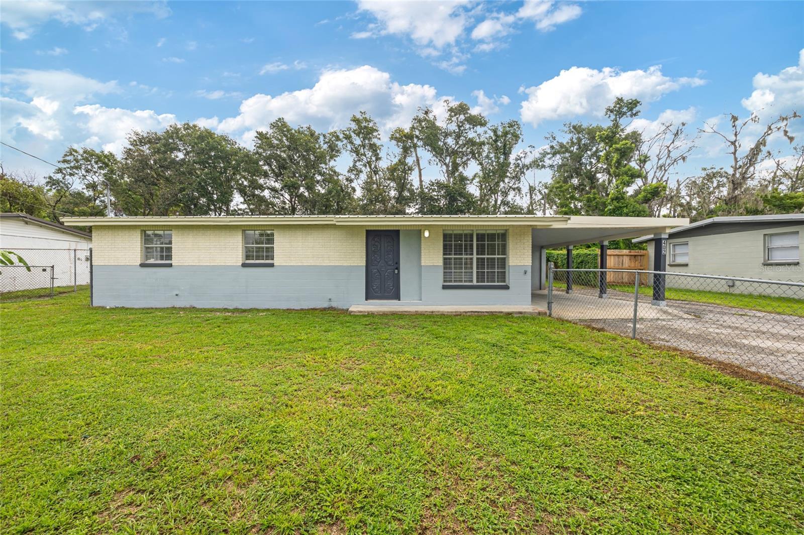 Welcome to Plant City! This beautifully remodeled 1,140 sq ft home offers 3 bedrooms, 2 bathrooms, and a versatile flex space that can serve as an office, game room, or even a fourth bedroom.

Notable updates include a brand-new water heater, 2020 A/C system, and a durable metal roof.

The entry opens into a spacious living area with an open-concept layout connecting the kitchen and living room. The kitchen is complete with solid wood cabinets, quartz countertops, brand-new appliances, and plenty of workspace for cooking and entertaining.

The primary bedroom features a private bathroom, while the secondary bedrooms share a full bath.

Step outside to a large screened-in patio overlooking the backyard—perfect for relaxing or hosting gatherings. A covered carport adds convenience and vehicle protection. For even more savings, the property includes well water and a septic tank.

With no HOA and no deed restrictions, this home combines modern updates, flexible living, and the freedom to truly live as you choose.