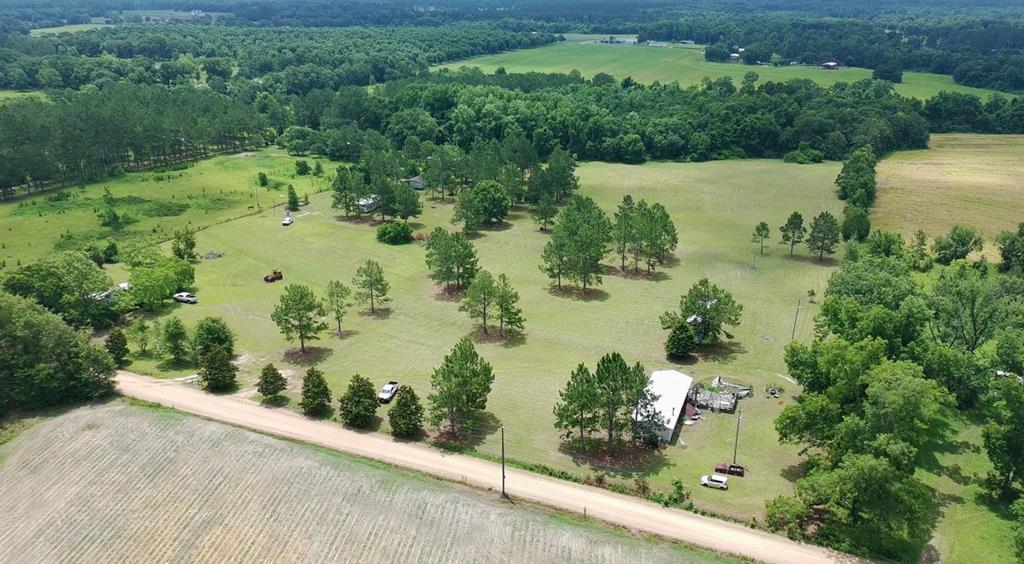 Prime 23-Acre Investment Tract with Multi-Income Potential! This versatile Grady County property features a scenic mix of woods and open land with over 630' of road frontage, excellent soils, and highly flexible land-use policies. Fully equipped with  a deep well with a high-pressure 5HP pump, 7 septic tanks, and 7 electrical service poles, the land is perfectly set up for development or immediate income. The property includes a main 3BR/2BA double-wide (1998 Sweetwater 24x66), an active RV site leased at $350/month, and 4 additional mobile homes (Fleetwood, Redman, and General models) ready for renovation or replacement. Ideal for sub-dividing into two 11-acre parcels or using for prime hunting and recreation.  Consider dividing out the doublewide on 2 acres and building on the balance of the land.  Take a walk through these woods and walk under the pines, and you will see, this is a good property!  Check out Land ID Link and see what you think.