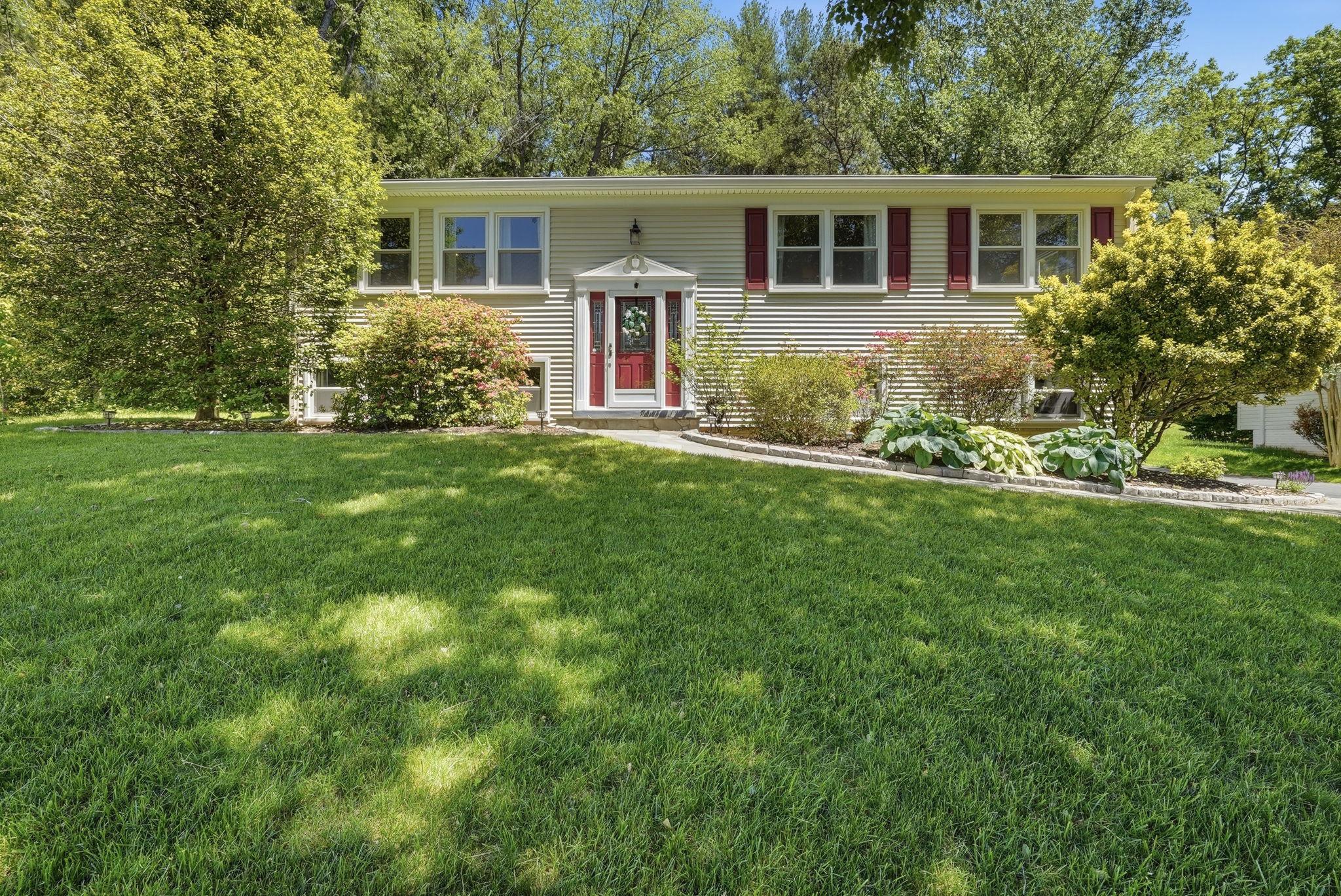 Welcome to 1811 Cranberry Lane — Tucked away on a quiet street in the heart of Reston, this beautifully updated 3-bedroom, 3-bathroom home checks every box. The bright, open main level flows effortlessly from the stylish kitchen — featuring granite countertops and stainless steel appliances — into the generous dining and living areas.  All three bathrooms have been thoughtfully renovated with sleek, sophisticated finishes. Step out onto the screened porch and unwind in your own private retreat, overlooking a sprawling, fenced .35-acre yard that backs to trees — ideal for entertaining, gardening, or simply enjoying the outdoors. The oversized two-car garage offers abundant space for vehicles and storage, with direct access into the home.  The lower level adds a sun-filled den and bonus office nook.  Ideally located just steps from the WOD trail and 2.3 miles from the Metro, this home offers easy access to everything Reston has to offer.  You'll enjoy world-class amenities, nearby trails and lakes.