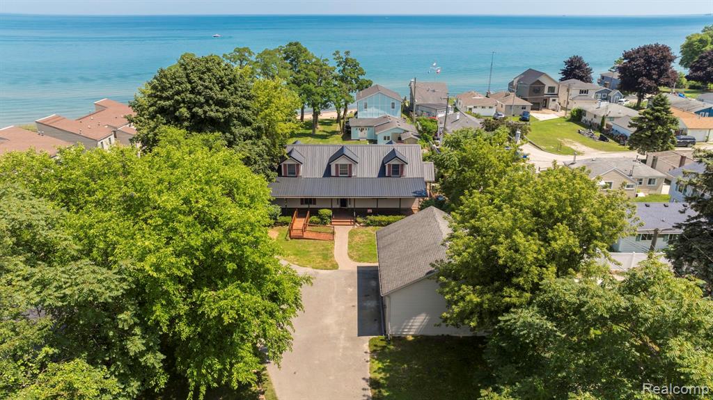 Welcome to your Lake Huron dream home! This stunning 2,300 sq ft lakefront retreat offers breathtaking water views from every room and direct access to a walkout sandy beach—perfect for morning strolls along the shoreline all the way to the nearby Lakeport State Park. With 3-4 spacious bedrooms and 3 full baths, there’s plenty of room for family and guests.—-

The open-concept kitchen, dining, and living areas are designed for seamless entertaining, all while enjoying panoramic lake views. The main floor features a serene master suite and convenient laundry, making single-level living a breeze. —-This thoughtfully designed home features step free entry, white doorways, and a barrier free layout, offering comfort and ease for a variety of mobility needs. —-Whether you’re looking for a year-round residence, a seasonal getaway or a profitable short-term rental, this rare Lake Huron gem offers the perfect blend of comfort, privacy, and natural beauty. —-Highlights include:  
Oversized 3-car garage with 10’ tall doors—perfect for boat or RV storage.  
—-Durable, waterproof luxury vinyl flooring throughout.  

—-Energy-efficient windows and mechanicals.  

—-Thoughtfully furnished and move-in ready.  

—-High-speed internet available.  
—-Pet free & Smoke free home.
—-Plenty of parking and outdoor space for family gatherings or summer fun.  

—-Quick access to Lexington, Port Huron, local marinas, I-94 & I-69 and the beautiful Lake Huron shoreline. A rare opportunity to own a walk out Sandy Beach lake property.  Walk the shoreline North to The Lakeport State Park.  
—-30' Deeded Private Beach access.  

—-Furnishings negotiable BATVAI