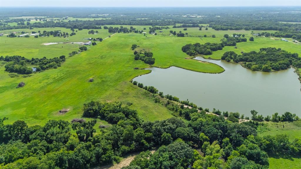 Here is possibly the most beautiful building spot in Hopkins County or all of NE Texas in this rolling 85 acre tract with hilltop overlooking a 17 acre private lake. (Please see video attached to listing) This picturesque property also has a large (over 200') peninsula that also would create a unique home building spot near the water or a place for boathouse or pier. There is just enough trees along the lake to provide privacy and a little shade with several beautiful Oaks that are scattered along the lakeside. This property has tremoundous sandy soil and the improved coastal meadows that have been managed  for hay production and livestock and also provide ag exemption on taxes. The lake provides unlimited opportunities for recreation, fishing, hunting and much more. When you see this property you will understand why this is one of the most sought after areas of Hopkins County and the location being only 5-6 miles from Sulphur Springs and Celebration Plaza for dining, shopping and all the great festivities and only a few miles from famous Lake Fork! Also, quick commute to I30 will get you to DFW in about 90 minutes. This is the perfect place for a lakeside home, investment, or that weekend getaway you have been looking for. With plenty of room and place to kick back and enjoy! With the topography and natural features this great property also has the possibilities of a beautiful subdivision.  Seller is open to working with buyers on exact boundaries as new survey will be needed at closing. 
Looking for less acreage, listing # 20974584 is avaiable with lake and 50 acres.