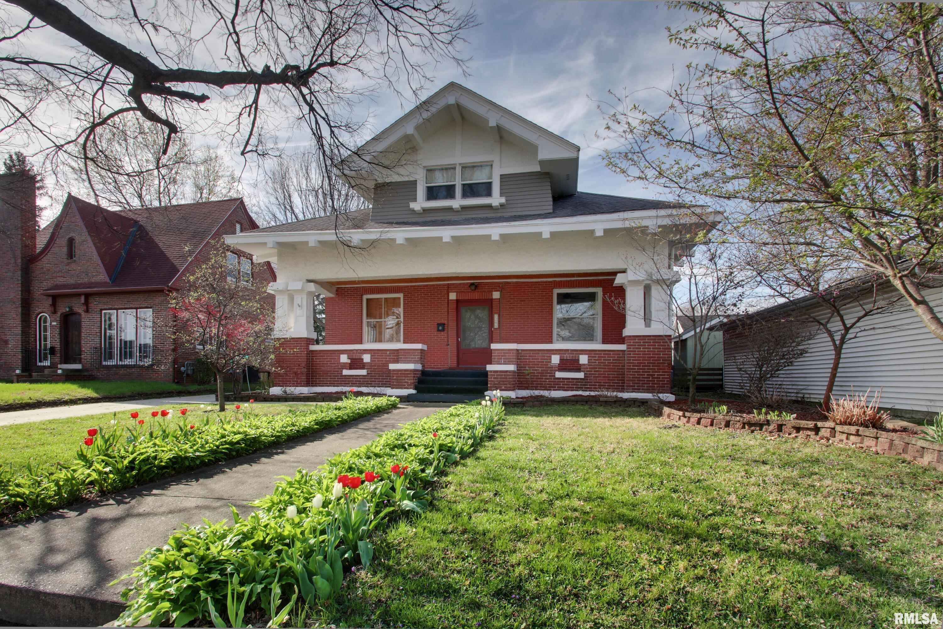 COMING SOON!   Step into timeless charm with this spacious brick bungalow located right in the heart of town! Offering 6 bedrooms & 4 full bathrooms, this home is filled with character featuring hardwood floors, original woodwork, built-ins & generously sized rooms throughout. The layout includes a cozy kitchen nook perfect for morning coffee, along with flexible space ideal for a home office, hobby area, or growing household needs. With two furnaces & two central air systems, comfort and efficiency are built right in. The second floor also features newer windows for added peace of mind. Enjoy relaxing evenings on the screened-in back porch or entertain on the outdoor decks overlooking a manageable, charming yard. Need space to tinker or create? There’s plenty of room for a workshop in the garage or basement! Lovingly maintained and cherished by the same owners for the past 20 years, this home is now ready for its next chapter.  You will love the numerous flowers, trees & birds that surround this classic home.   Other updates include water heater-'26, painting, driveway, soffits repaired & relined gutters.