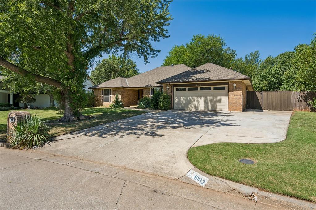 Welcome to Newman Drive in the established Briarcreek neighborhood known for mature trees, spacious lots, and homes with thoughtful layouts. This well-designed property offers excellent curb appeal, an ideal split floor plan, and abundant natural light throughout. With 4 (or 5) generously sized bedrooms, 3 full bathrooms, two flexible spaces, and a two-car garage, the home delivers comfort, versatility, and room to grow. The two flexible rooms provide endless possibilities - a second living area, formal dining, home office, workout space, or even an oversized 5th bedroom - ideal for multi-generational living. The kitchen is spacious and functional, offering a large eat in breakfast area, built-in appliances, extensive cabinetry, bar seating, and a built-in desk with glass front cabinets - perfect for organizing recipes, homework, or a home command center. The main living area features a focal point fireplace with built-ins and French doors overlooking the backyard, creating an inviting gathering space. The primary suite is impressively sized and includes an ensuite with two vanities, a makeup vanity, two walk in closets, and French doors leading directly to the patio - ideal for morning coffee or easy access to outdoor living. Step outside to a covered patio with plenty of room for entertaining and relaxing. The backyard offers an 8x8 storage building, 6x8 additional storage area, vegetable garden, small koi pond, pergola, and ample open yard space! Additional highlights include zoned heat and air, two water heaters, inside utility room with space for a mud area, extra driveway parking, mature landscaping, accessibility friendly doorways and grab bars, wet bar, refrigerator, abundant storage throughout, and Pella windows in select areas. Located in a welcoming neighborhood just moments from shopping, restaurants, and schools, this home offers convenience, comfort, and room to personalize. Schedule your showing today!