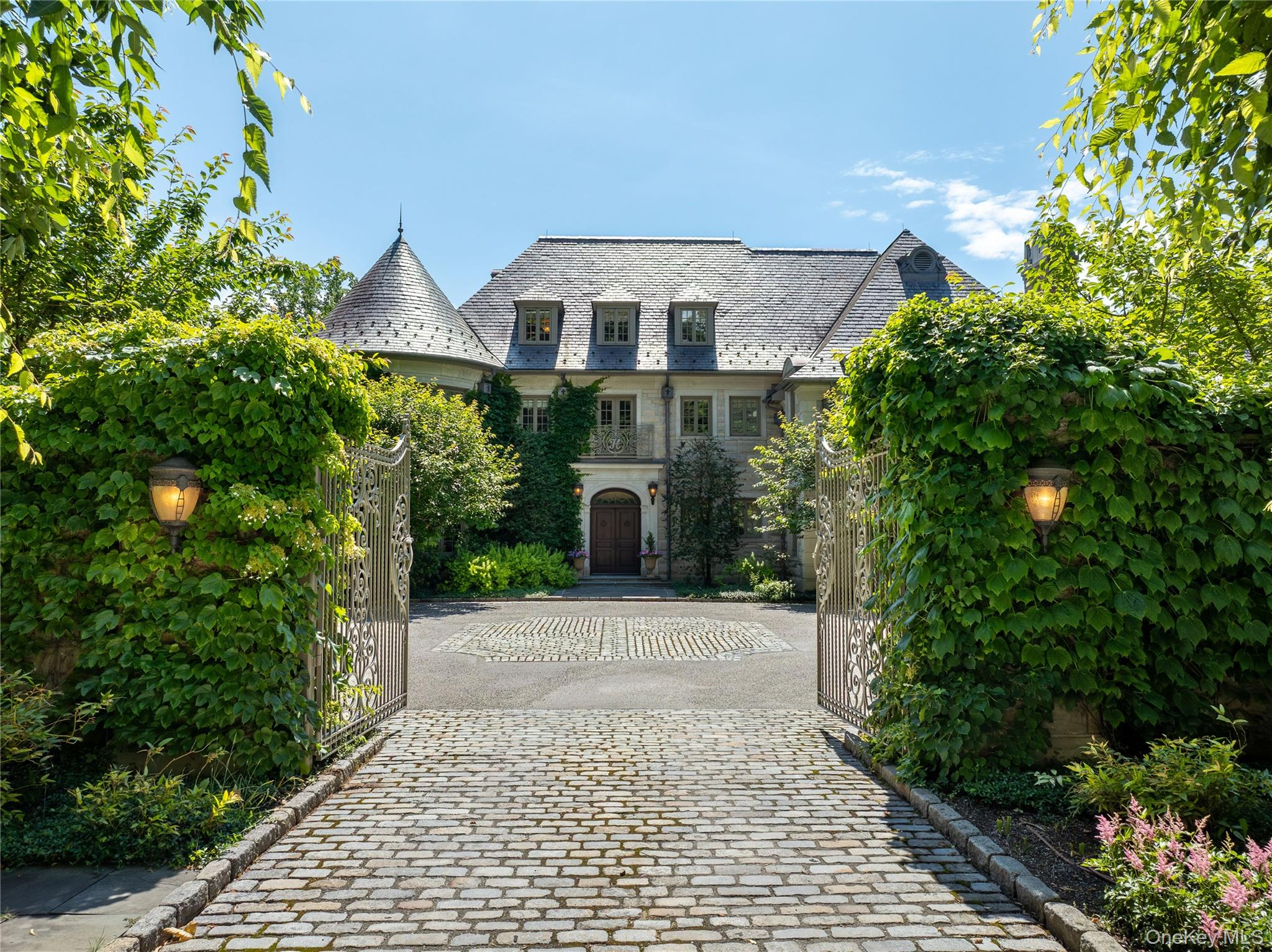 This spectacular limestone French Manor estate sits on 10+ acres on Converse Lake with 100'+ of lakefront in exclusive Conyers Farm, a guard gated community with private security. Custom designed for the current owners by architect James Davis, this meticulous home features impressive attention to detail. The main & garden level of the home are ideal for entertaining with an oversized great room, music room, formal living and dining room with double-sided fireplace. Many rooms open onto the terraces overlooking the lake and pool. The master bedroom suite is comprised of 3 rooms; sleeping room, sitting room with a balcony and luxurious onyx bath. The four finished floors of living space feature 8 bedrooms, 11 full baths, 2 powder rooms, a full gym, indoor half basketball court with NBA 3-point line, a steam room, home theatre and every modern amenity. The grounds include a heated pool & spa, golf green & playground. There is a separate pool kitchen with dining area and changing rooms. Additional Information:  Amenities:Dressing Area,Marble Bath,Soaking Tub,Storage,HeatingFuel:Oil Above Ground,ParkingFeatures: 4+ Car Attached,