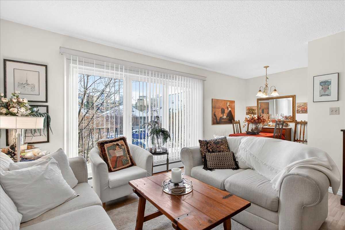 Location! Location! Bright, charming, and inviting—this one-bedroom Sunnyside condo is ready to welcome you home! Quick possession is possible. You will be impressed! Located in a small, established building on a quiet street, this well-kept unit offers a comfortable and functional layout with plenty of natural light. The living room features a large patio door that fills the space with sunshine. The private balcony extends your living space to the outdoors with city and street views. The functional kitchen is conveniently positioned just off the living room and connects to a comfortable dining area, creating an open and practical space for everyday living. The generously sized bedroom offers a large wardrobe closet with excellent storage, while easy-care laminate flooring provides a clean and practical finish throughout. An assigned parking stall is included, adding everyday convenience, while the excellent location means you can easily leave the car at home. Just steps from the Sunnyside C-Train station, you’ll have easy access throughout the city, including the University of Calgary and SAIT. And when it’s time to get out and explore, the Bow River pathways, downtown and Kensington are all close by. Enjoy nearby cafés, restaurants, shops and boutiques, or take advantage of the incredible walkability that makes this such a popular inner-city community. Whether you’re a first-time buyer, investor, or simply looking for an affordable way to enjoy Calgary’s inner-city lifestyle, this bright one-bedroom condo offers an excellent opportunity in a fantastic location.  An unbeatable location—come see what makes this Sunnyside condo such a great place to call home! A pleasure to show.