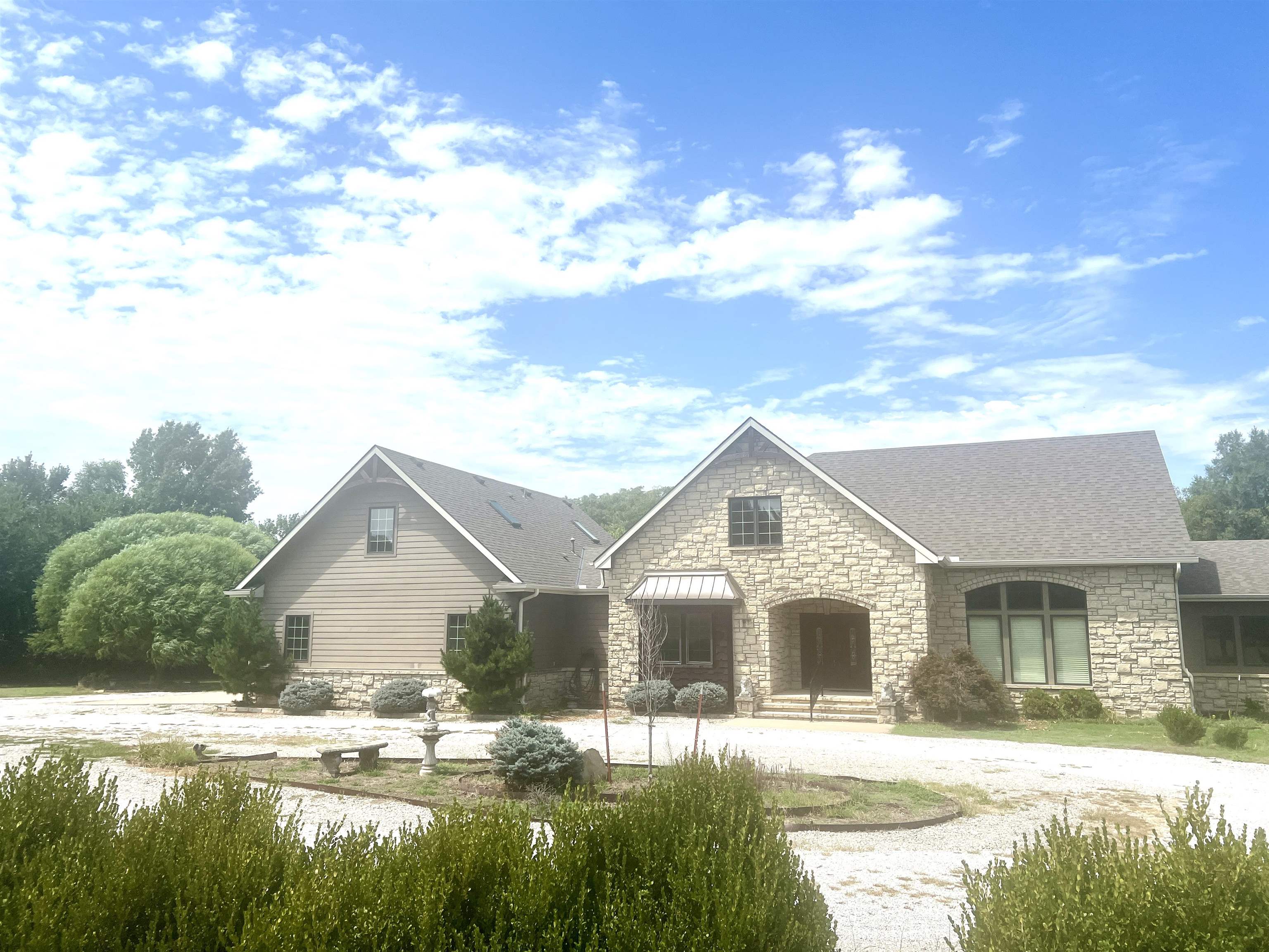 This is the property that you have been waiting for!!!!!! Sitting on 8.01 acres, this gorgeous home has everything that you could possibly want and more!!!! When you enter the foyer, you immediately realize the planning, care, quality and taste of this  custom built spectacular home. On the main level is the luxurious living room with a fireplace, gourmet kitchen with an island for extra work space and seating, a large dining room, guest suite, half bath, laundry/utility/mud room and a master suite with a walk in closet, enormous master bathroom and it's own den.The master walk in closet is also the safe room. Off the dining room and living room is a screened-in porch  overlooking the  18x40 salt water pool (deep end in the middle with stairs on each end.) The wood floor on the main level is Brazilian cherry wood -stunning!!! Upstairs are three bedrooms and two bathrooms, great privacy for everyone!! Outside is beautifully and professionally landscaped. There is a special little garden area for the puppies and a half bath accessible from the pool ( no wet feet tracking thru this house).The pool liner and pool cover are new. The air conditioners are new with an assumable warranty for $99.00 a year. There is a gazebo on the south side of the house with wrought iron fencing around the pool. For safety and comfort there is a power generator. Ready to move?!?! Give the listing agent a call for a private showing!!!!All information is deemed liable but not guaranteed.