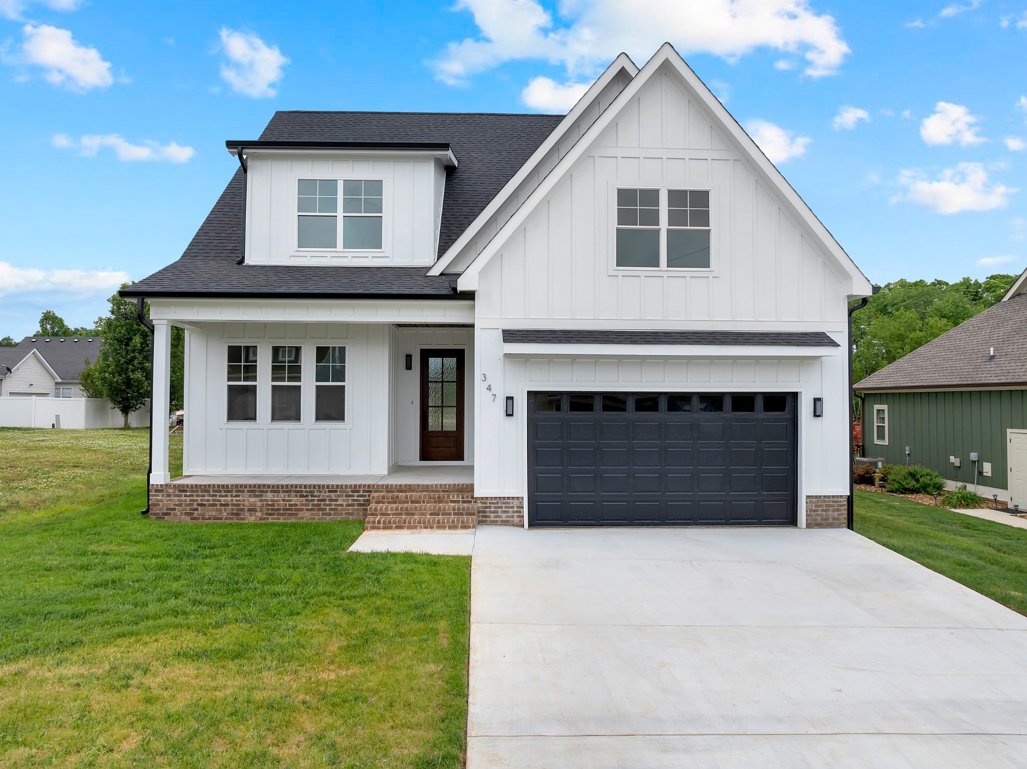 Step into luxury living at its finest with this exquisite new construction nestled inside a highly sought-after gated lake community. From the moment you walk through the door, you're greeted by soaring ceilings and an abundance of natural light pouring through the walls of windows-creating a bright, airy feel that instantly feels like home. The heart of the home is a dream kitchen featuring custom cabinetry, stunning countertops, and storage galore, perfectly designed for both everyday living and entertaining in style. Every detail has been carefully curated, blending modern elegance with timeless craftsmanship. Offering 2,930 sq. ft. of upscale living space, this home is packed with high-end features, including heated bathroom floors that bring an extra touch of comfort and indulgence to your daily routine. Located in a gated lake community loaded with amenities, you'll enjoy the ultimate lifestyle experience. Hop on your golf cart and within minutes you'll be at the marina and floating restaurant, making lake days and sunset dinners effortlessly accessible. This isn't just a home...it's your everyday getaway.
