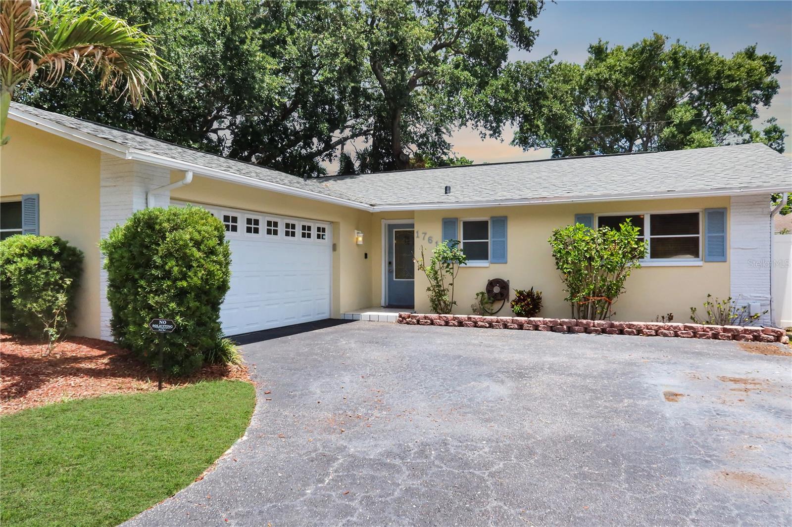 Experience elevated Florida living in this exquisitely updated Clearwater home, where modern finishes and timeless comfort come together seamlessly. Boasting 3 bedrooms, 1.5 bathrooms, and over 1,450 square feet of refined living space, this residence has been thoughtfully enhanced with luxury wood-look flooring, designer-inspired neutral interiors, refreshed baths, and exceptional curb appeal. The expansive homesite provides a private outdoor retreat perfect for entertaining, relaxing, or creating your own backyard oasis. A spacious two-car garage, meticulous landscaping, and a prime central Clearwater location further enhance the home's appeal. Conveniently positioned minutes from world-renowned Gulf Coast beaches, upscale shopping, dining, golf courses, and major transportation corridors, this turnkey property presents an outstanding opportunity for buyers seeking a blend of sophistication, convenience, and Florida lifestyle.  Situated in a desirable central Clearwater location near shopping, dining, major roadways, Gulf beaches, airports, and top Pinellas County amenities, this home delivers exceptional value and everyday convenience. With no HOA and no flood insurance requirement, this is a rare opportunity to own a beautifully maintained property in one of Clearwater's most accessible neighborhoods. Roof is 5 years old and the AC unit is 4 years old.Professionally enhanced photography has been utilized to showcase the home's features and design. Any virtual staging or digital enhancements are clearly intended to illustrate the property's potential and may not reflect current furnishings or conditions.